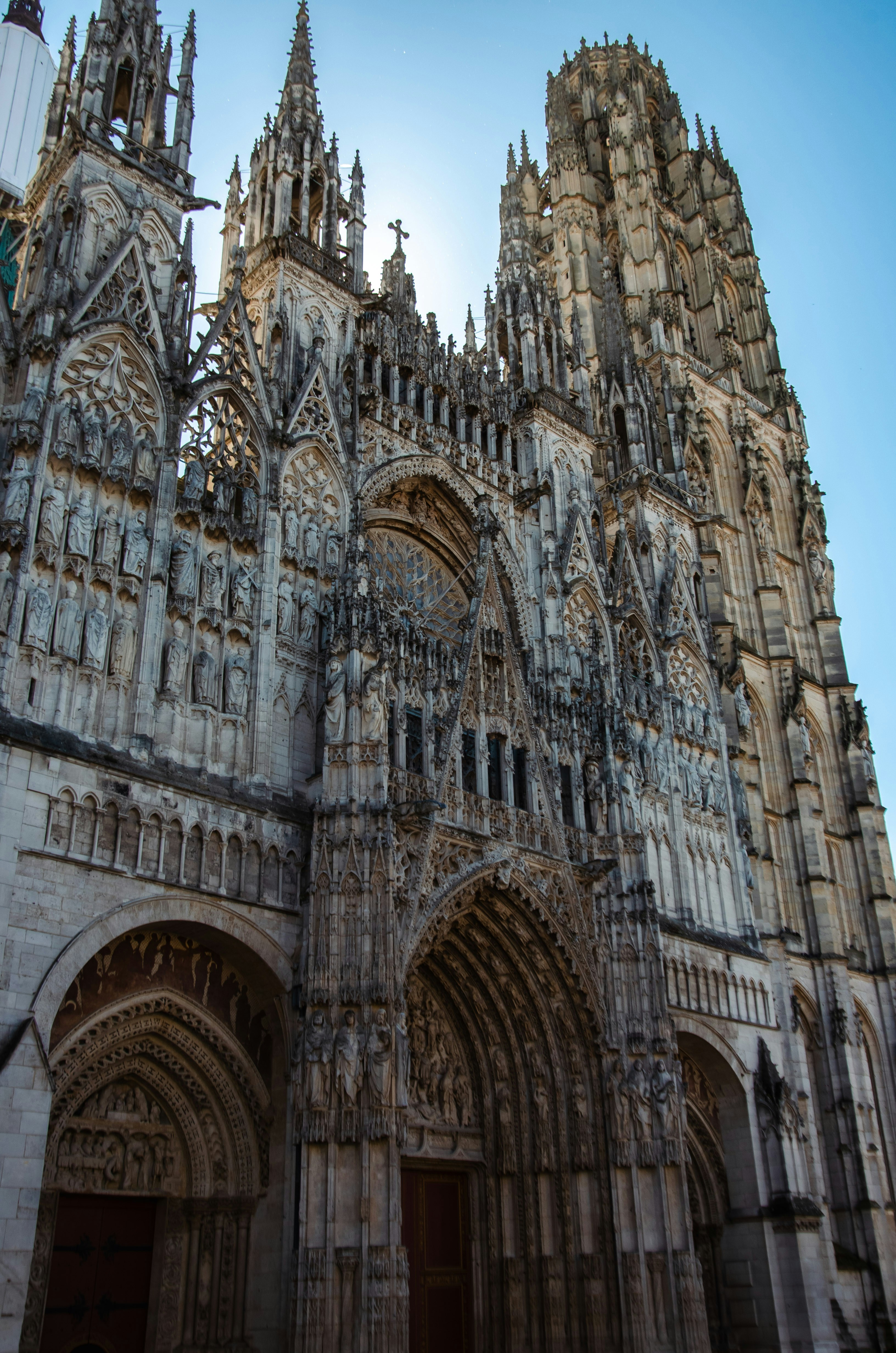 Ornate gothic cathedral facade against a clear blue sky