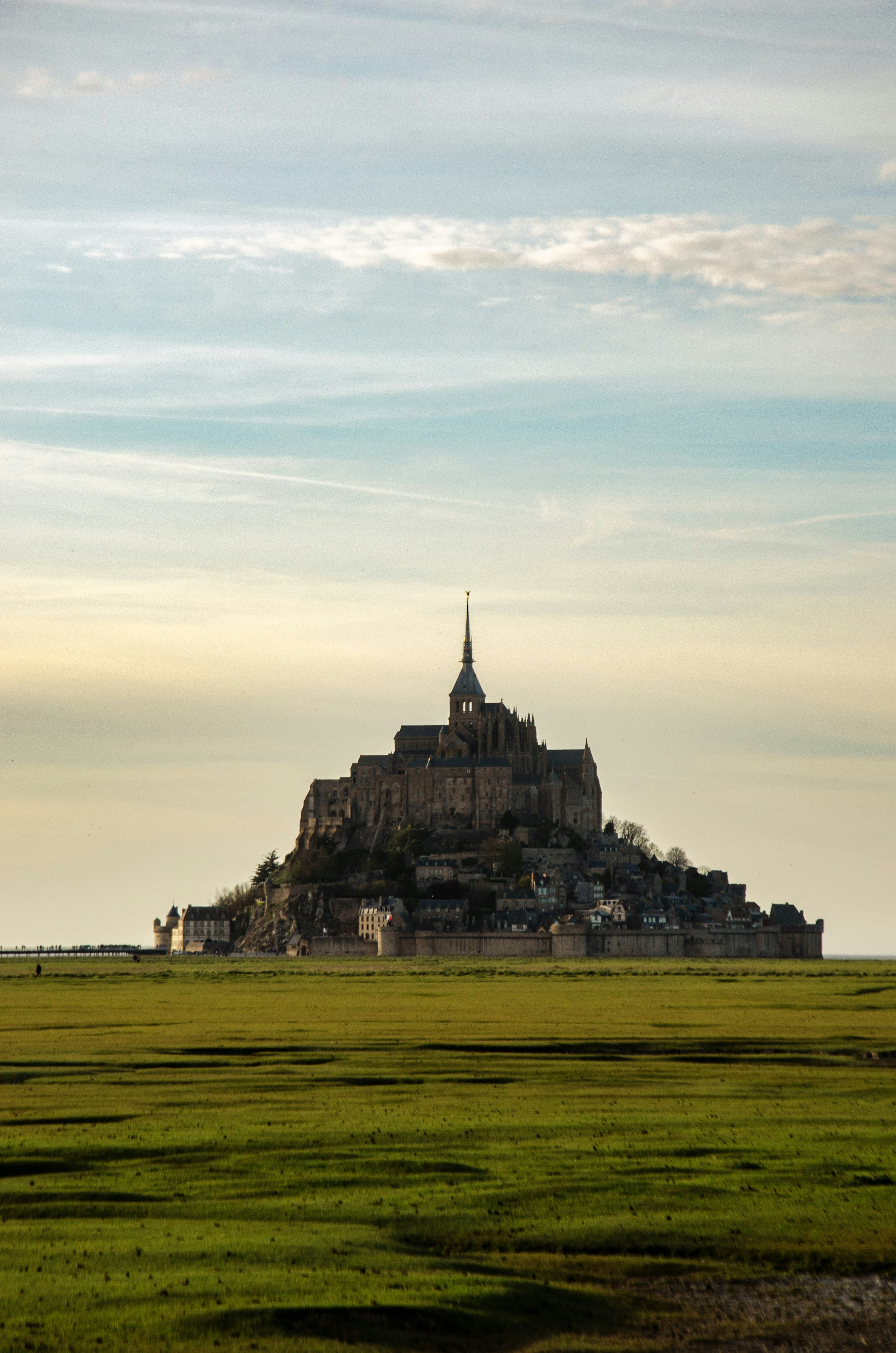 Mont saint-michel island fortress under a cloudy sky