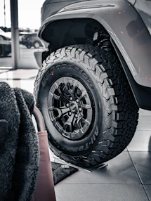 Close-up of a rugged off-road tire on a vehicle.
