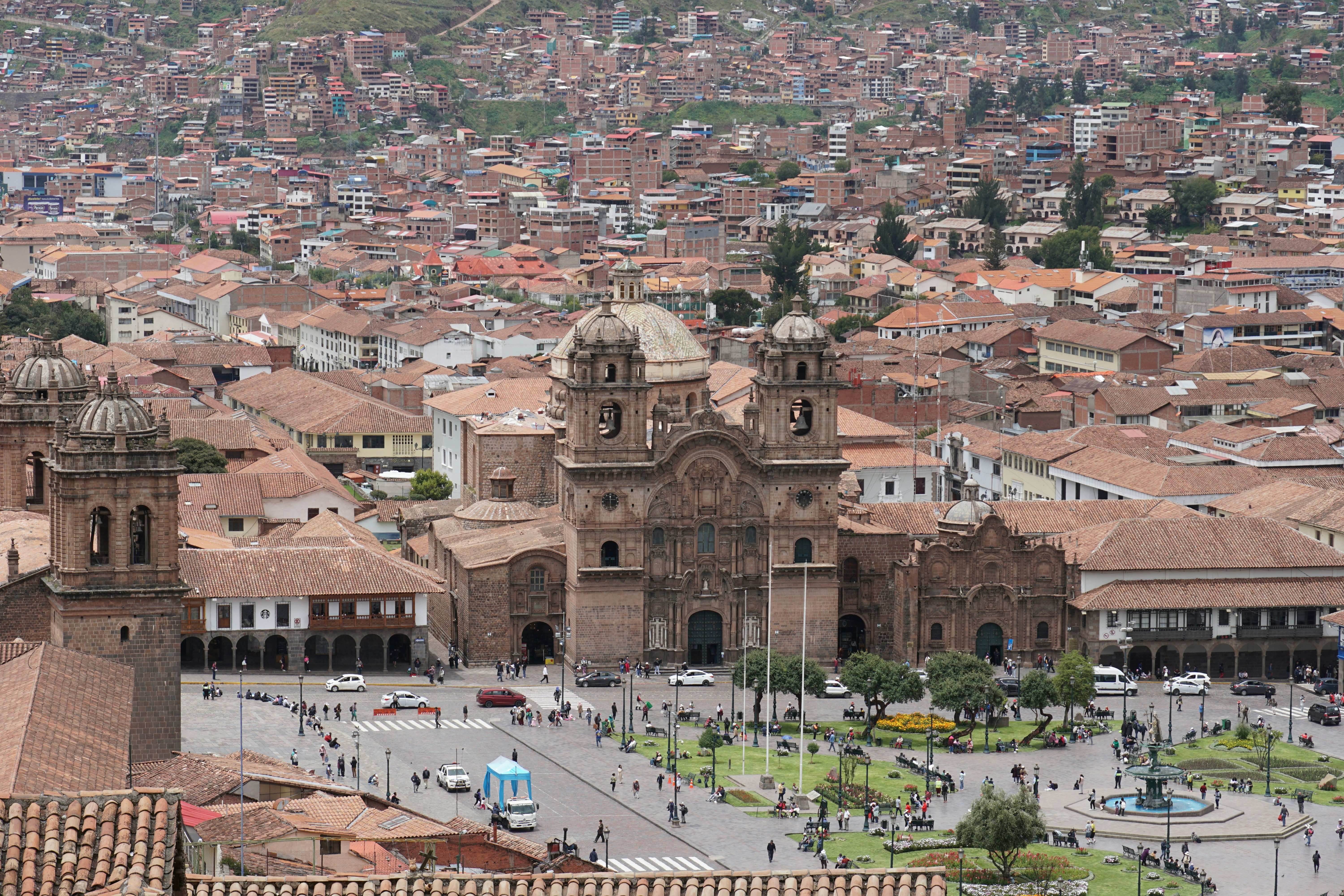 Historic city square with a large cathedral and buildings.