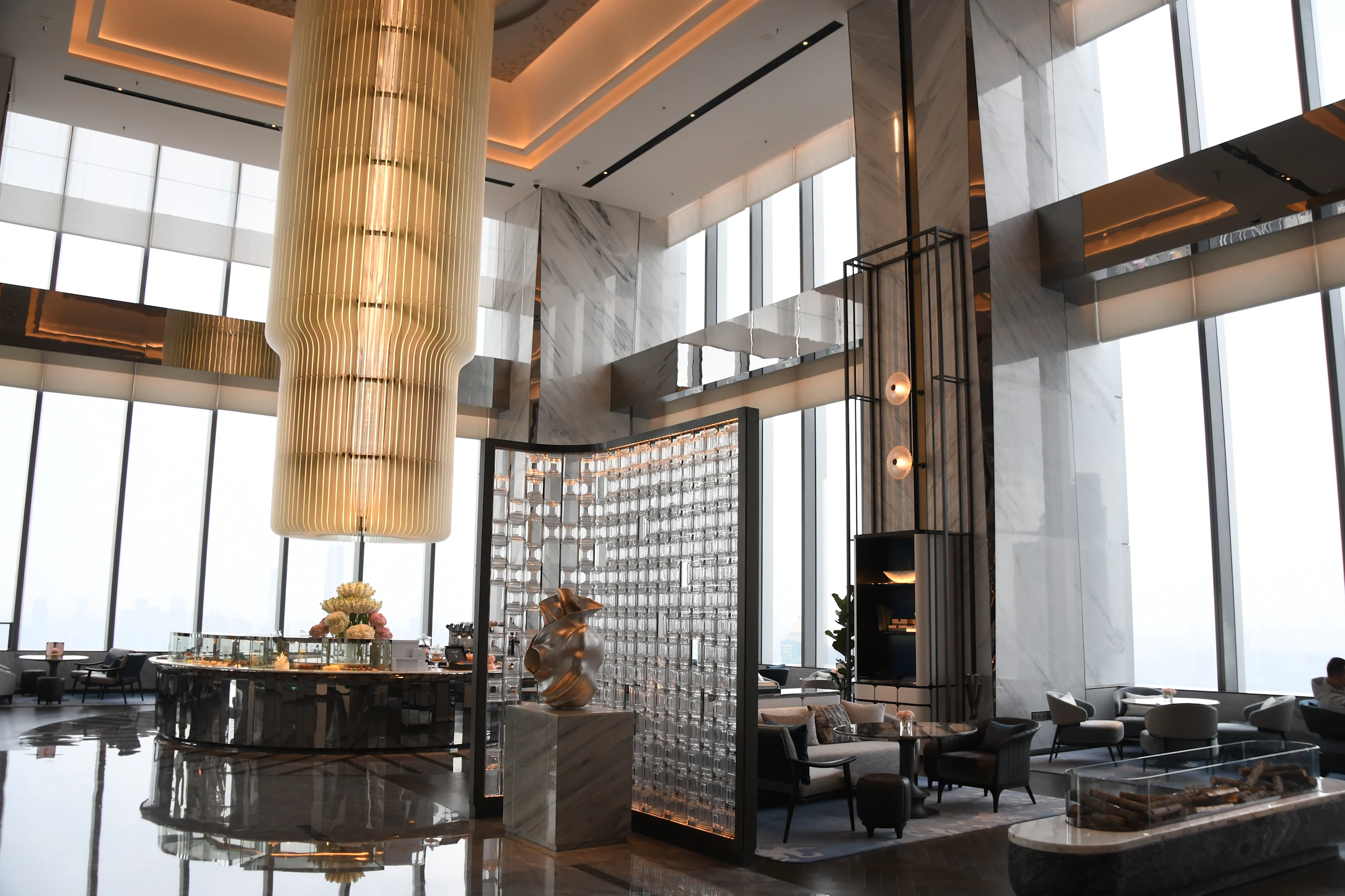 Marble hotel lobby with chandelier