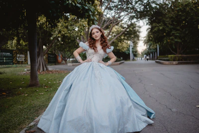 Young woman in a light blue ballgown and tiara.