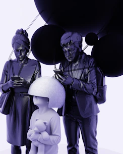 Family with child looking at phones near dark spheres