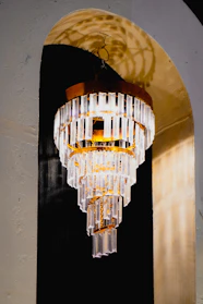 Elegant tiered crystal chandelier with golden accents