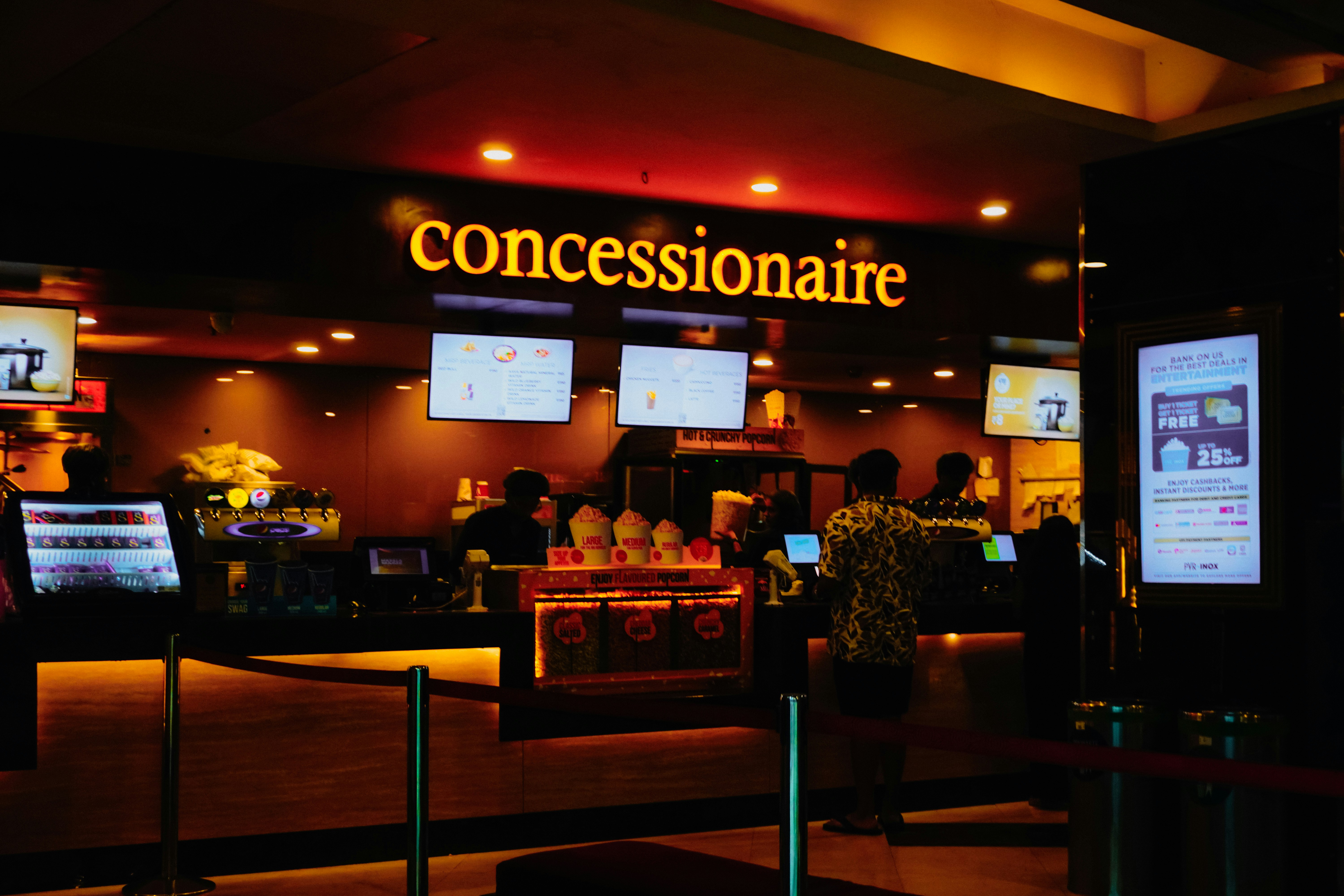Cinema concession stand with glowing sign