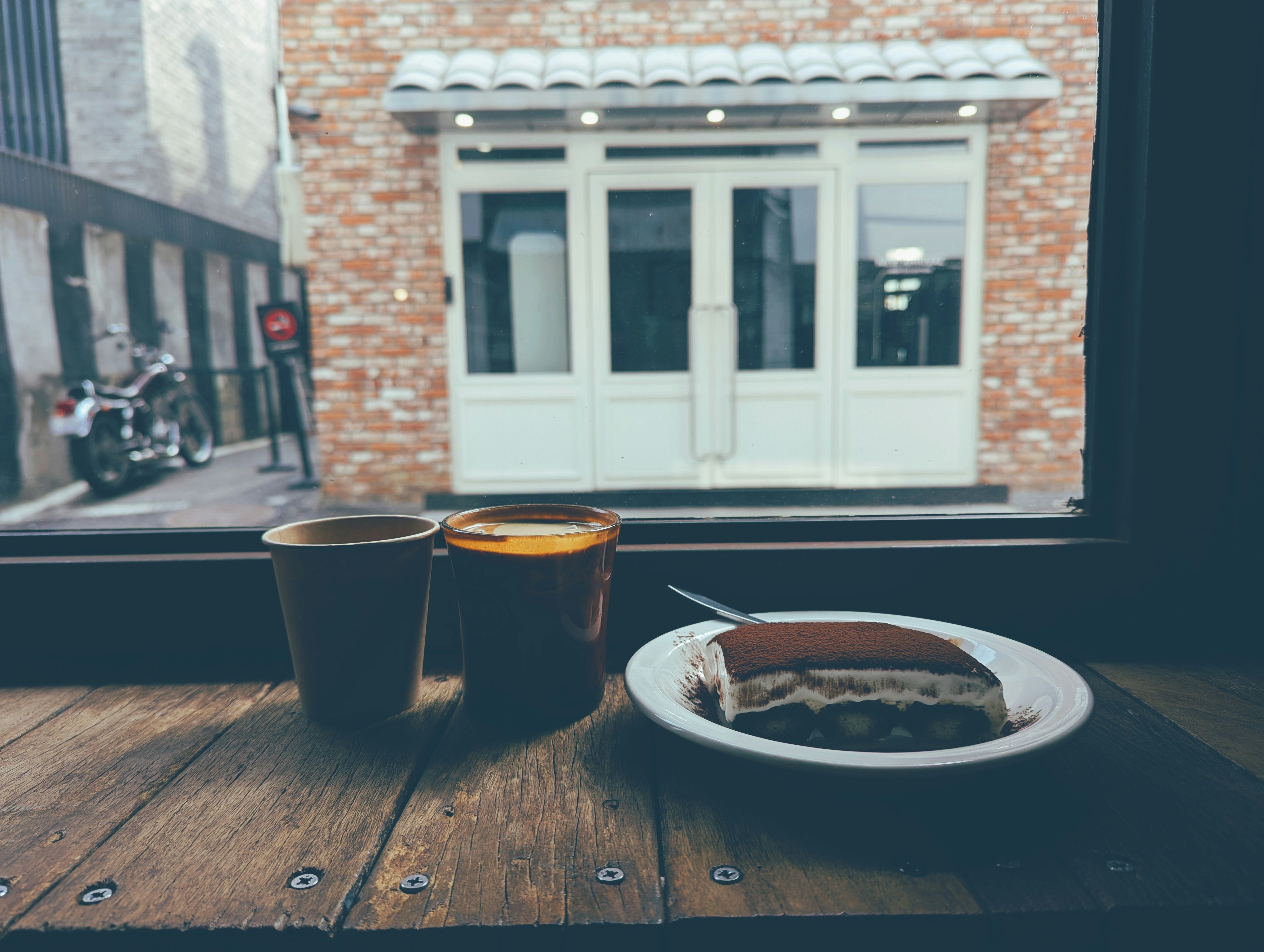 Tiramisu and coffee on a wooden table