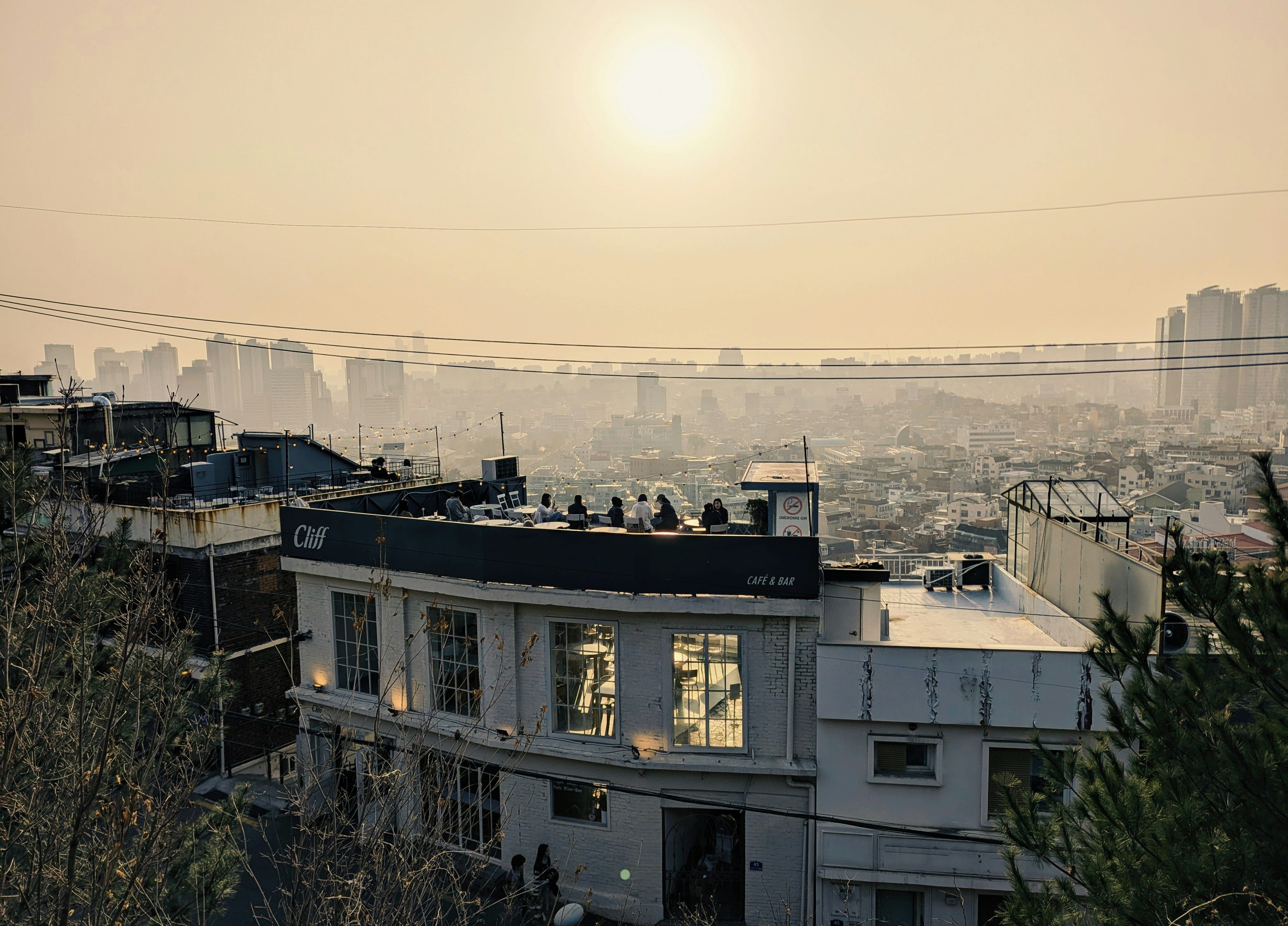 Buildings and city skyline under hazy sun