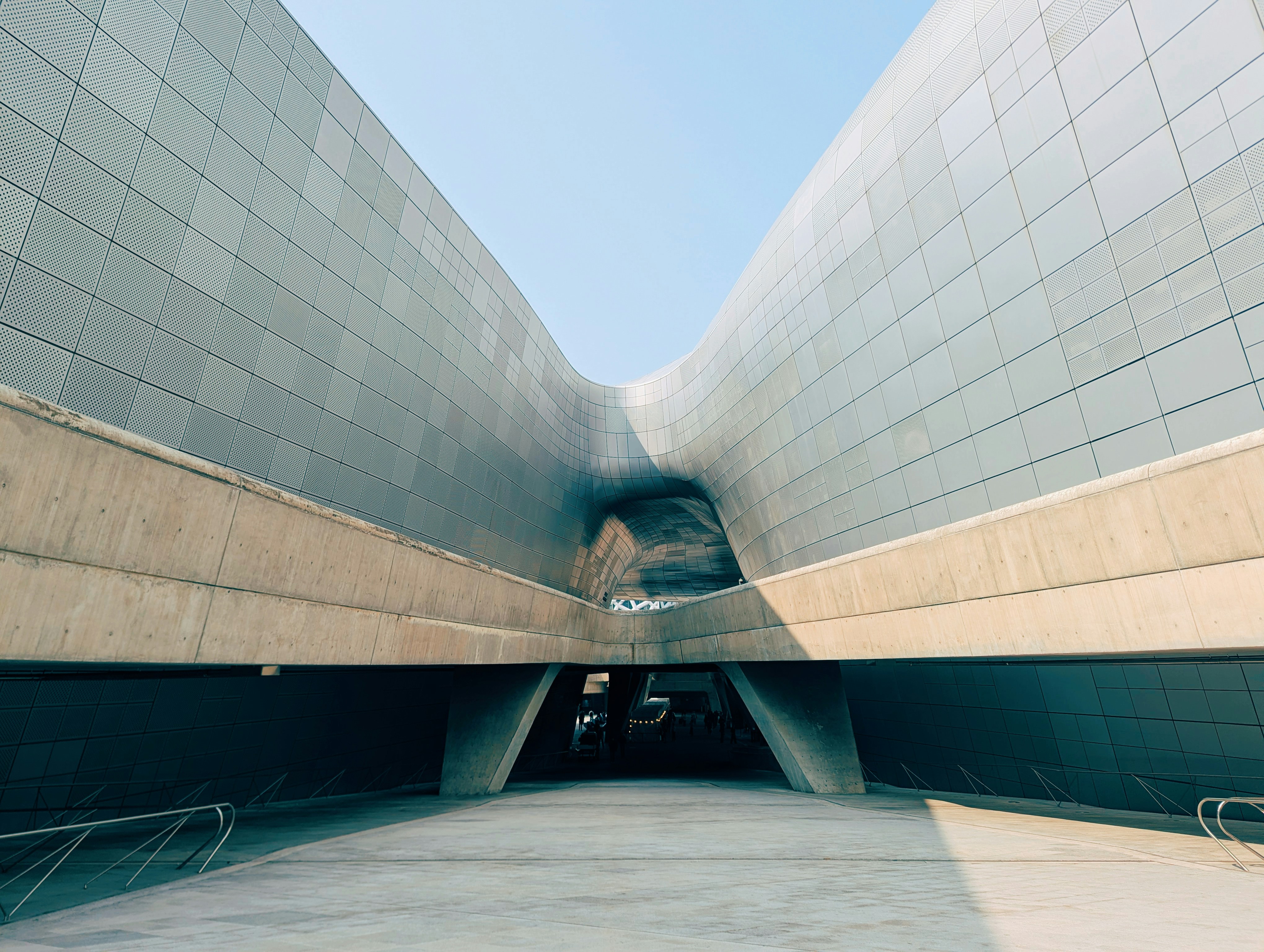 Modern architectural building with curved metallic facade