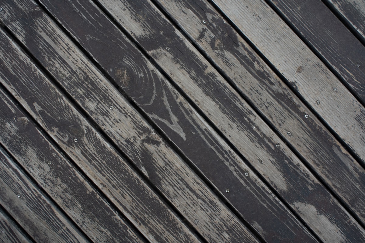 Newly stained dark deck planks at an angle