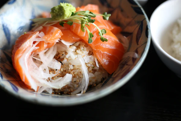 A kaisendon rice bowl topped with fresh Hokkaido salmon and garnishes
