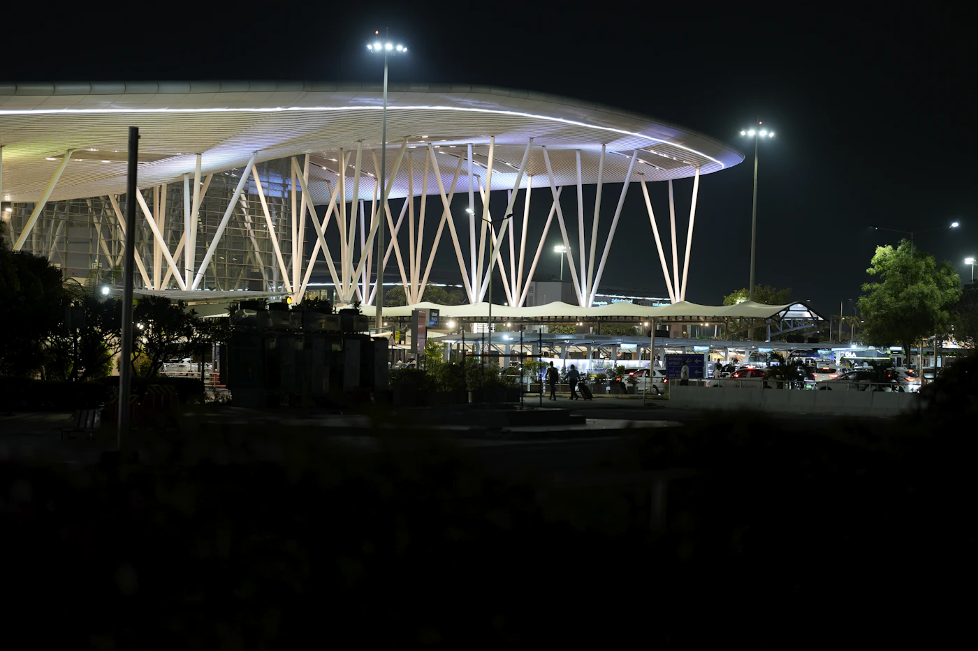 An airport terminal lit up at night