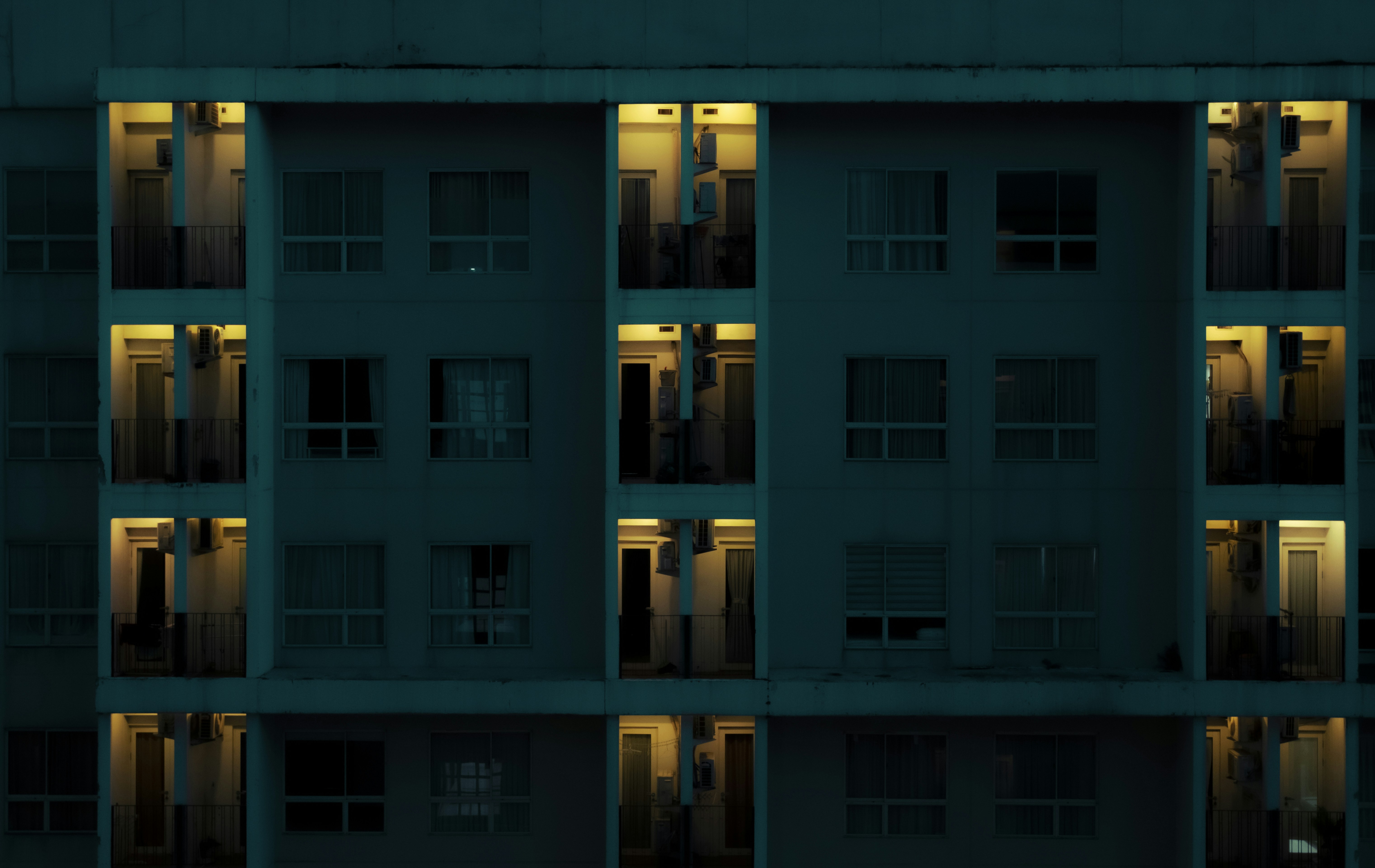 Apartment building at night with illuminated windows