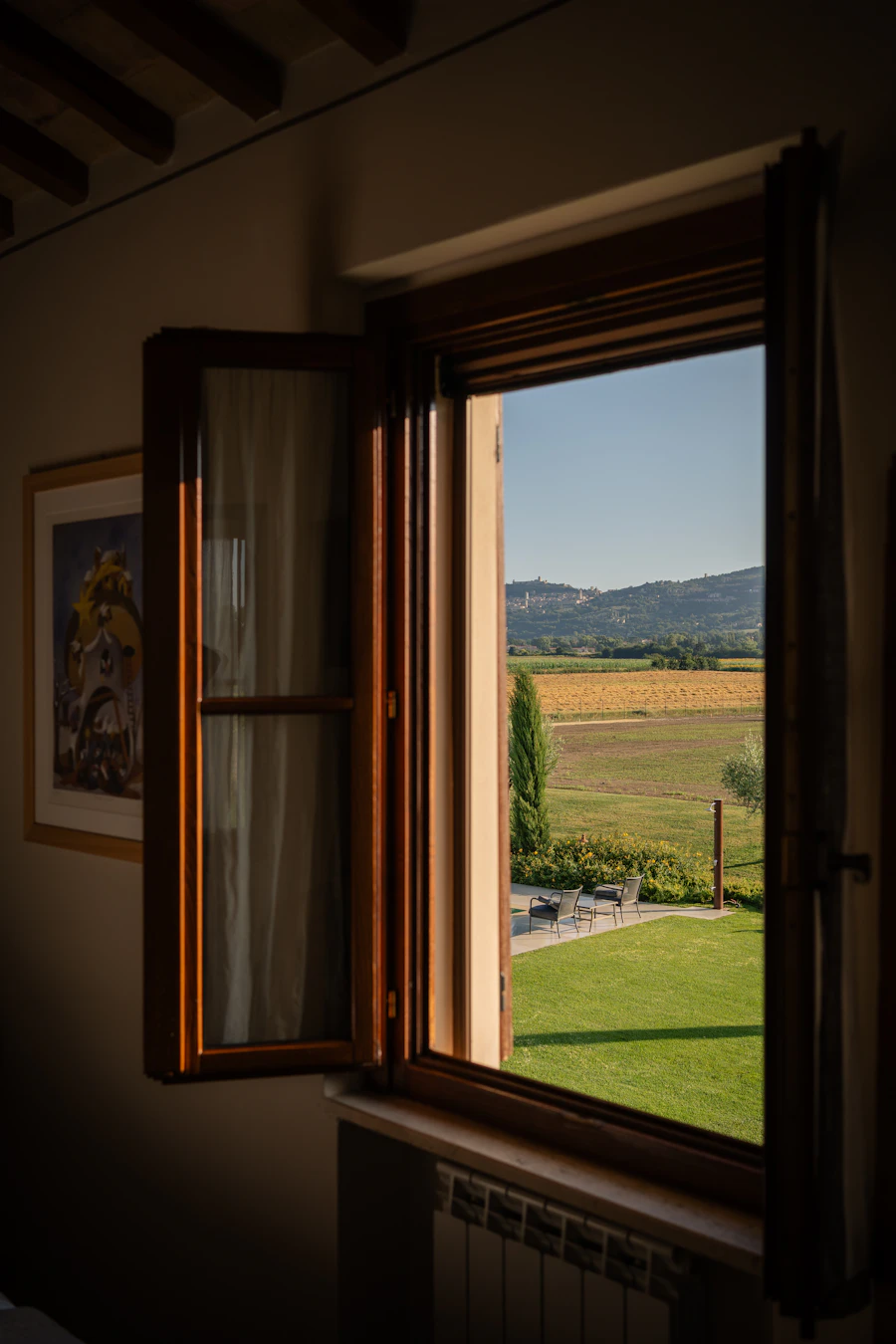 Rural landscape through open window