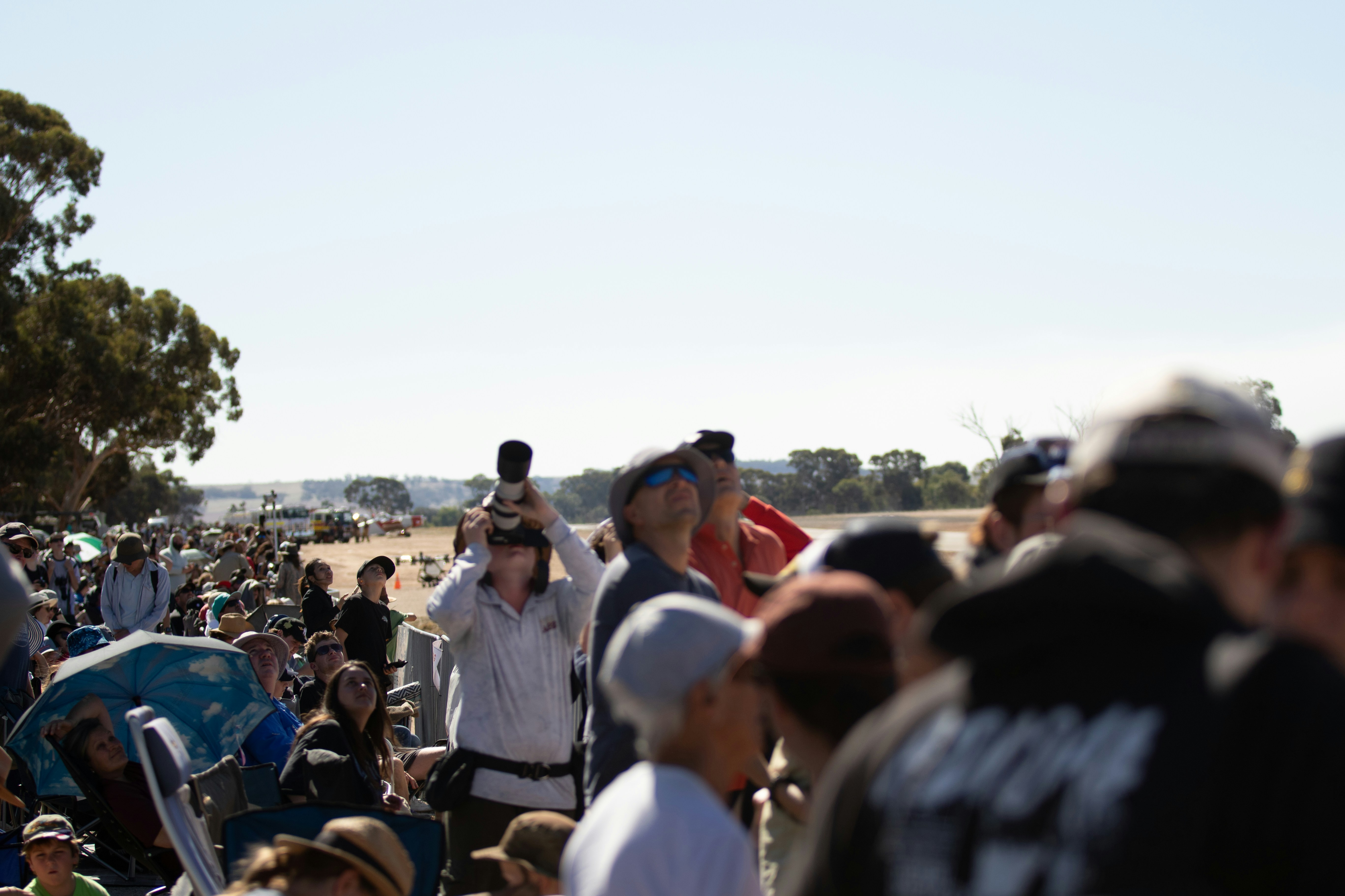 Crowd gathered outdoors on a sunny day