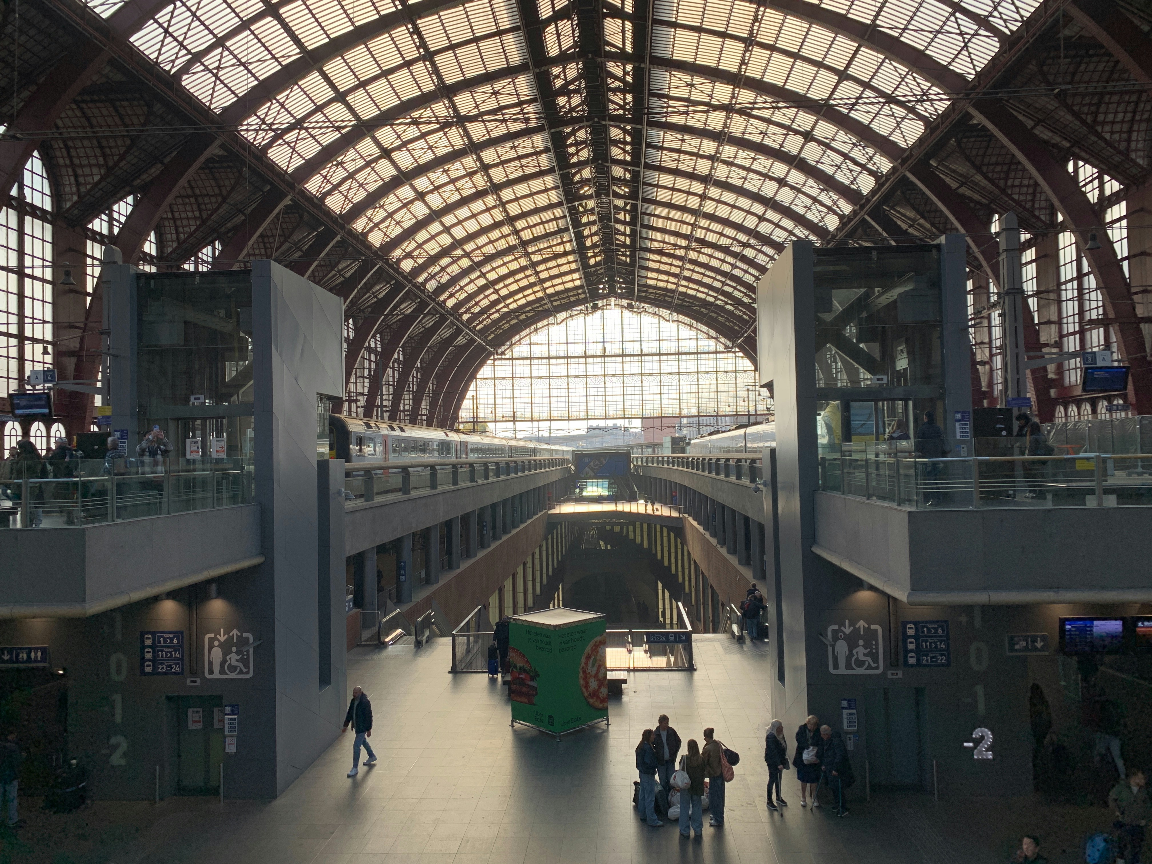 Interior of a grand train station with arched ceiling