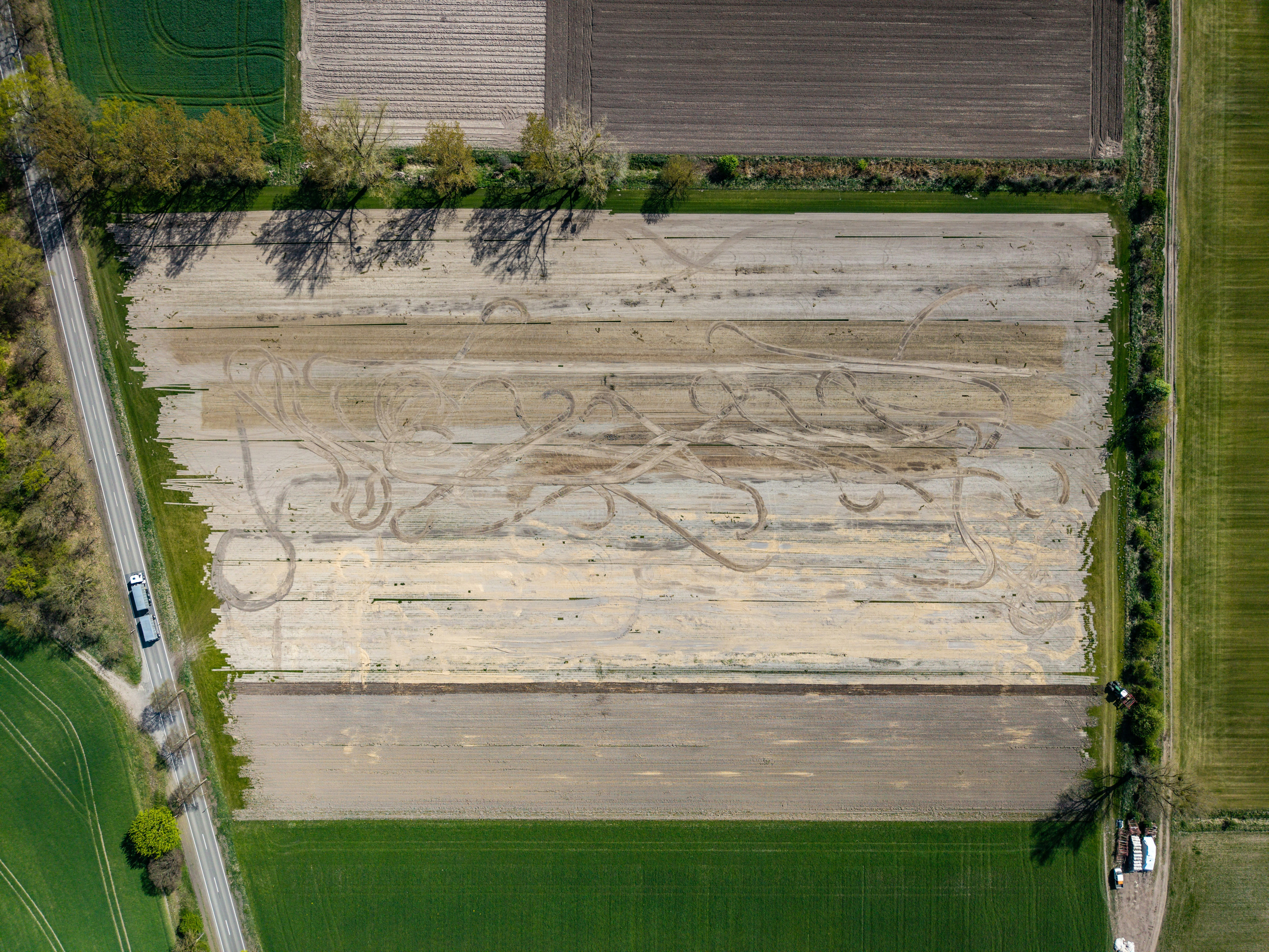 Aerial view of a crop field with swirling patterns