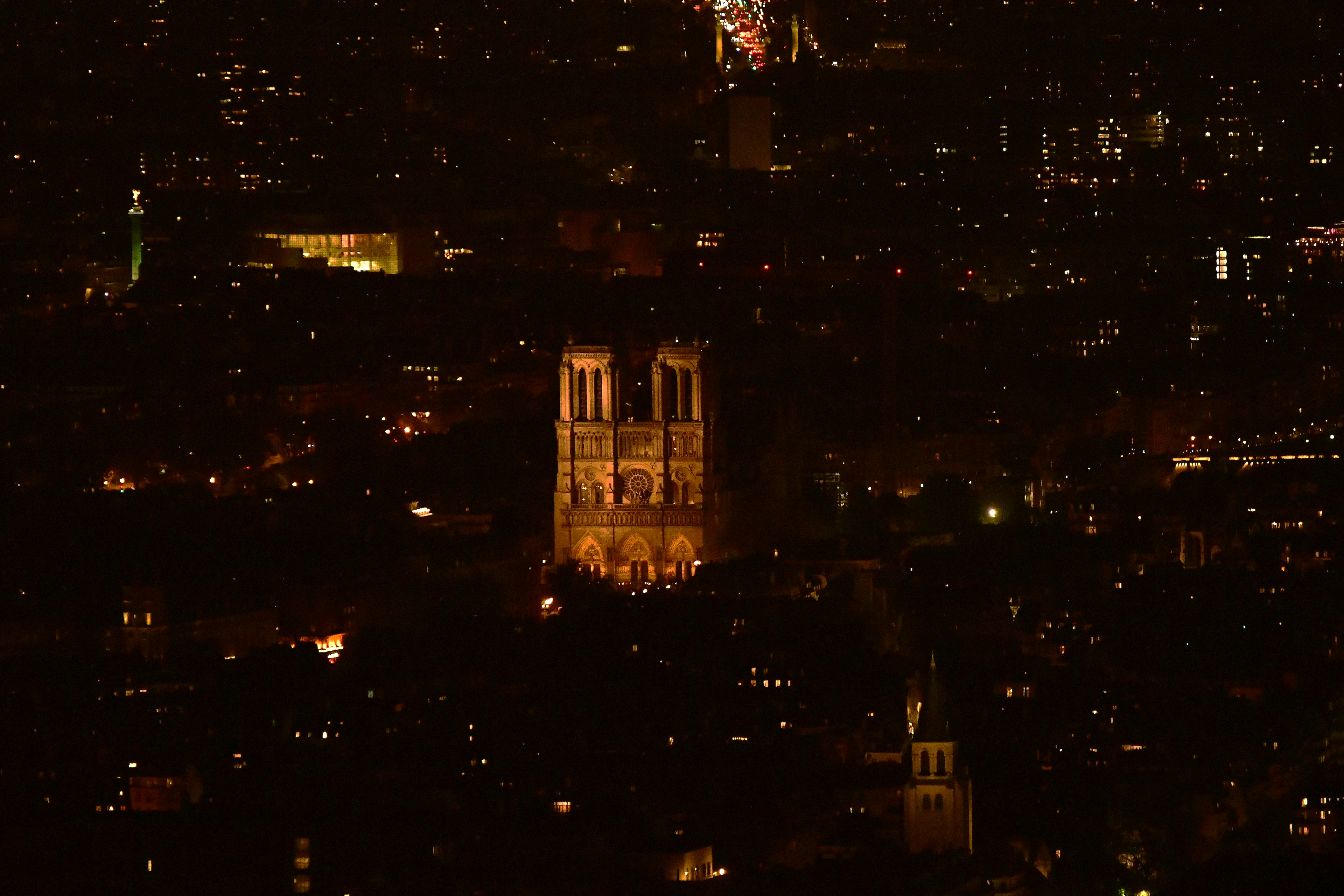 Notre dame cathedral illuminated at night in paris