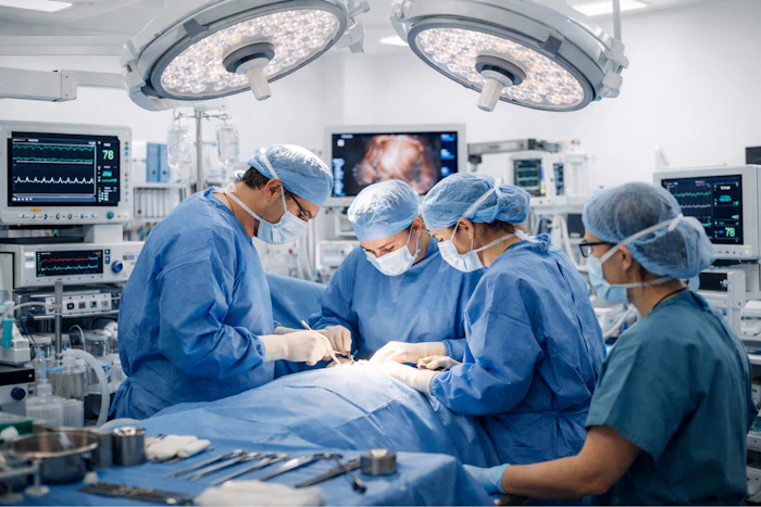Surgeons performing surgery in a modern operating room