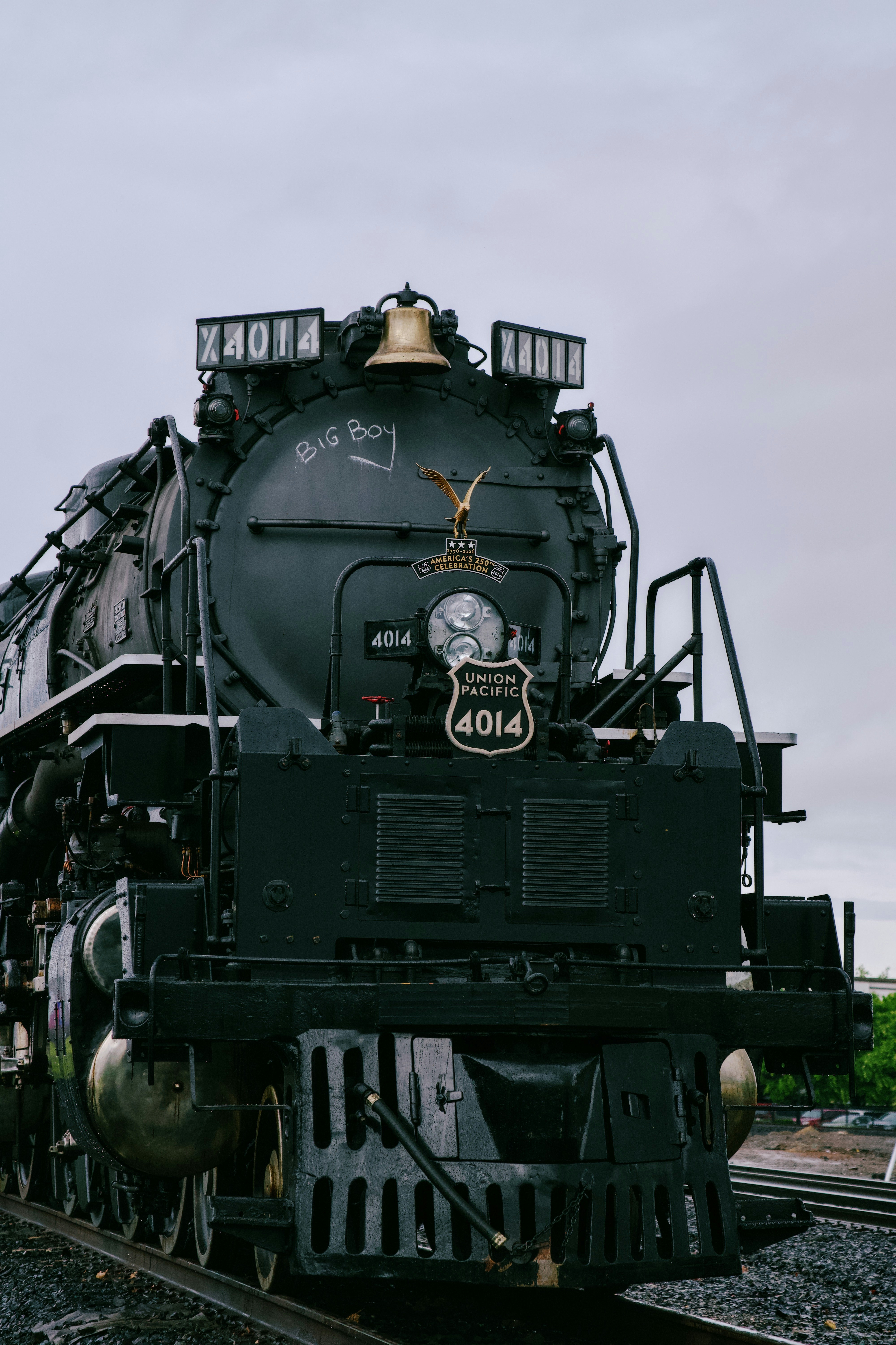 A large black steam locomotive with number 4014