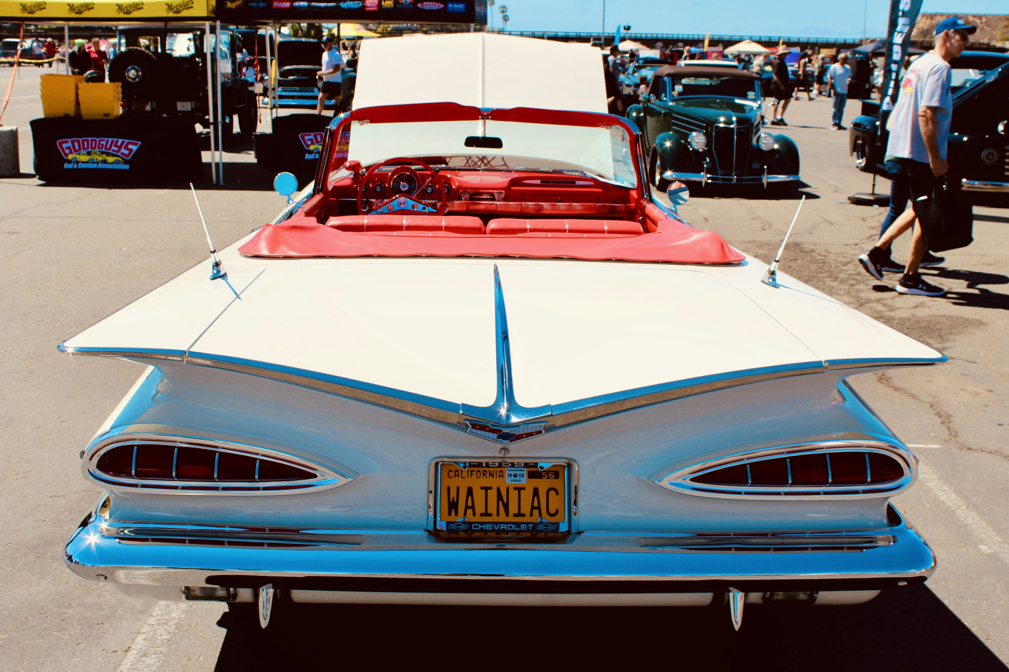 White vintage convertible car with red interior