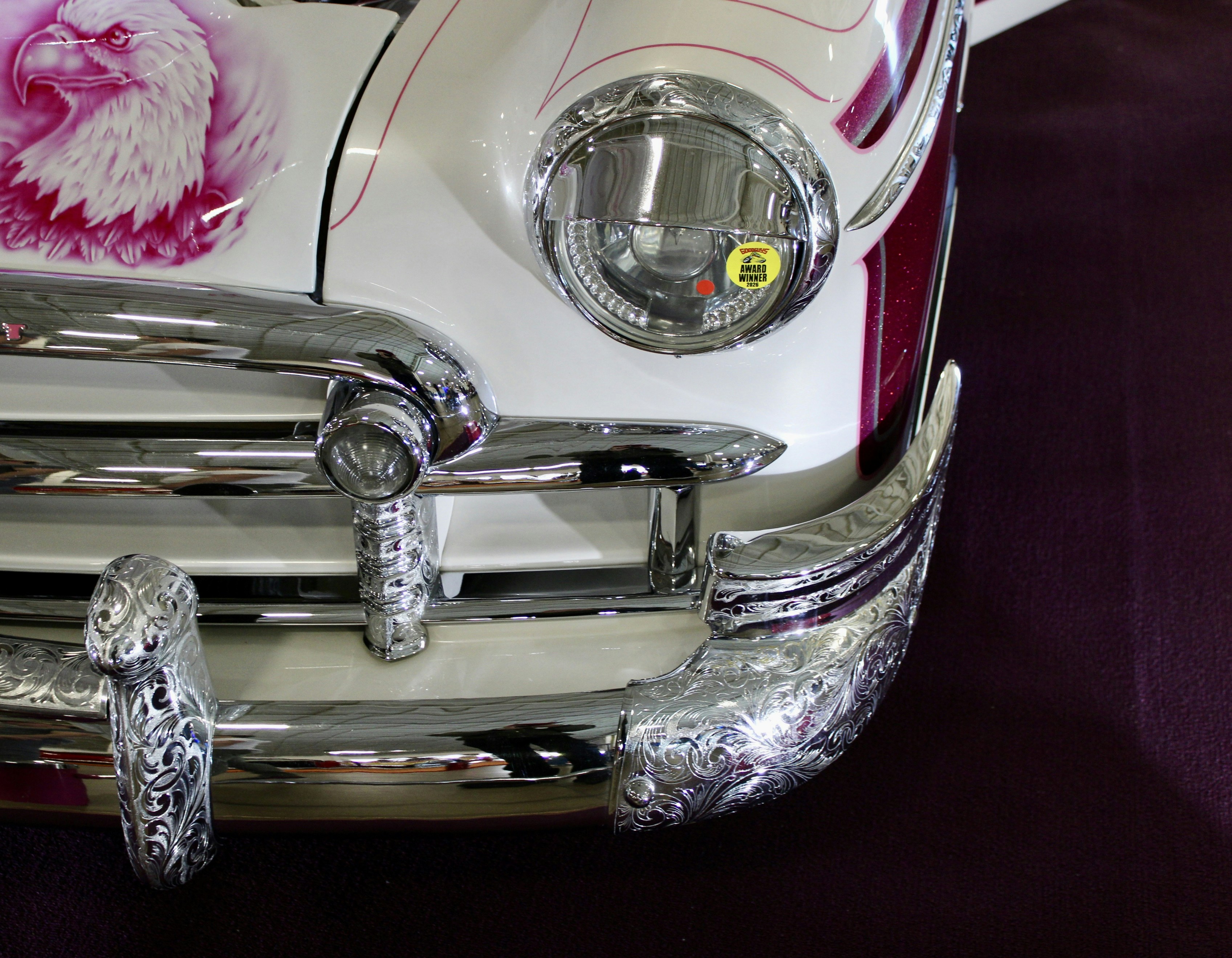 Close-up of a vintage car's chrome bumper