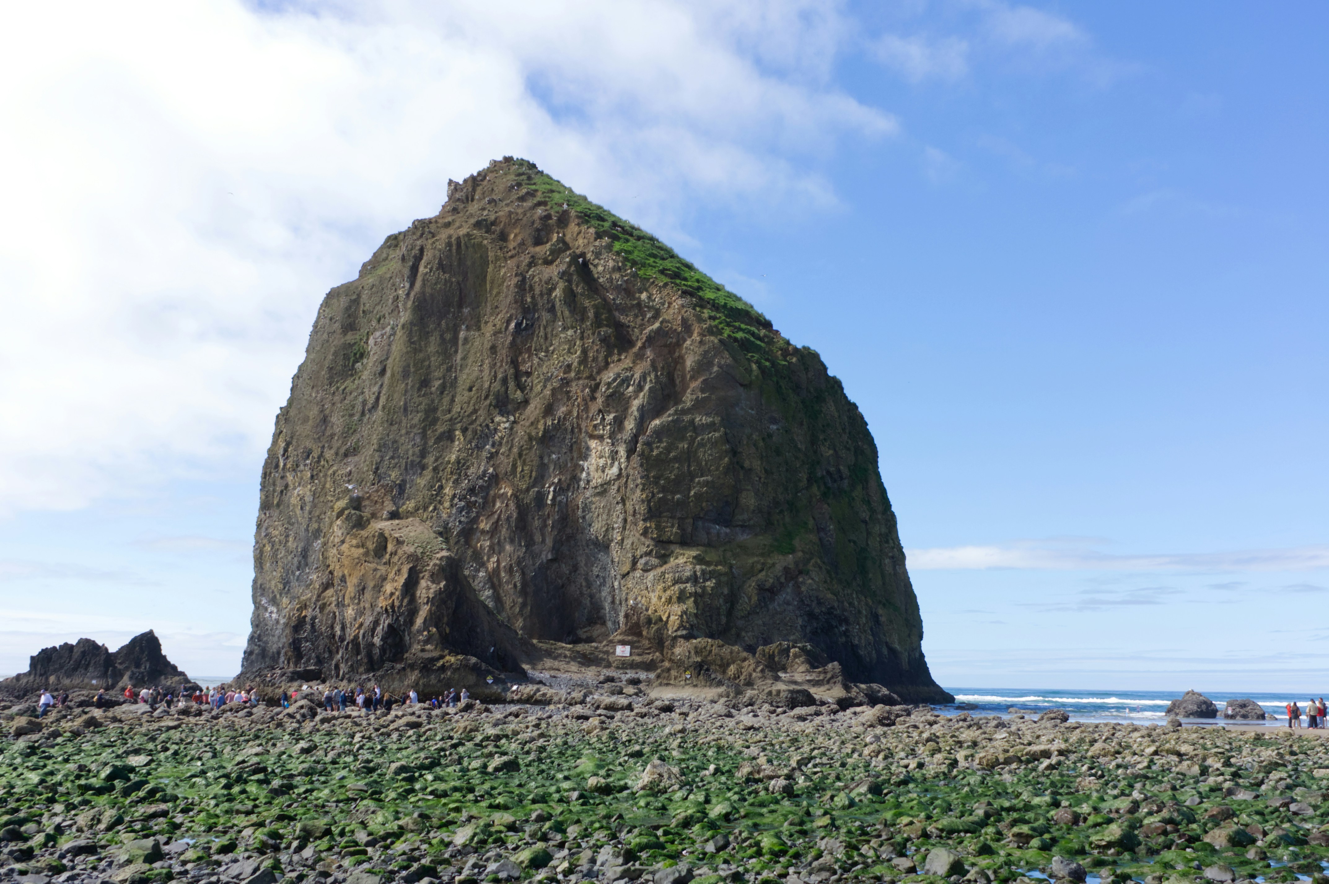 Haystack Rock at Cannon Beach Oregon with tide pools in the foreground