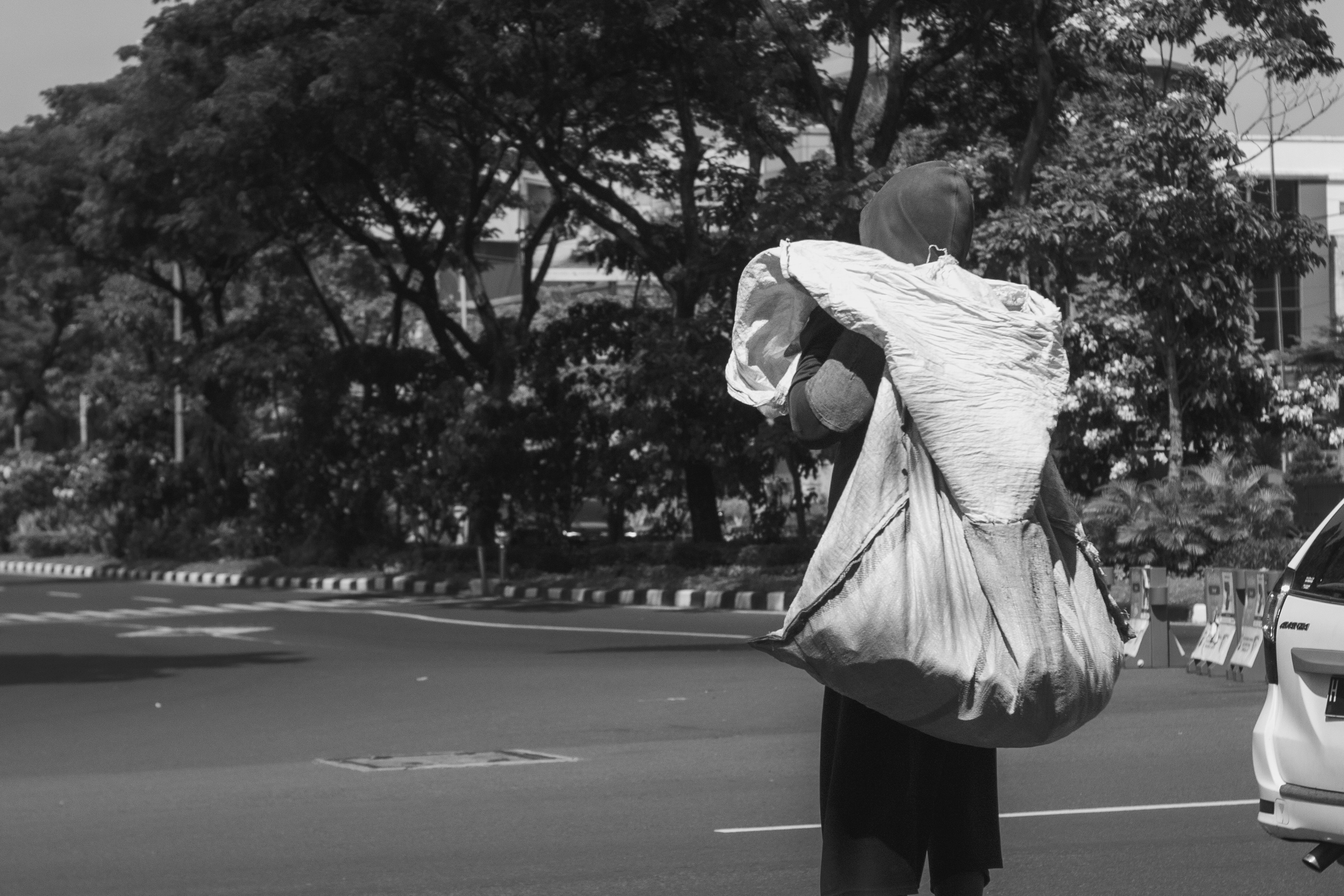 Man carrying large bag on his shoulder