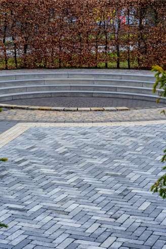 Curved stone steps lead to a central circular area