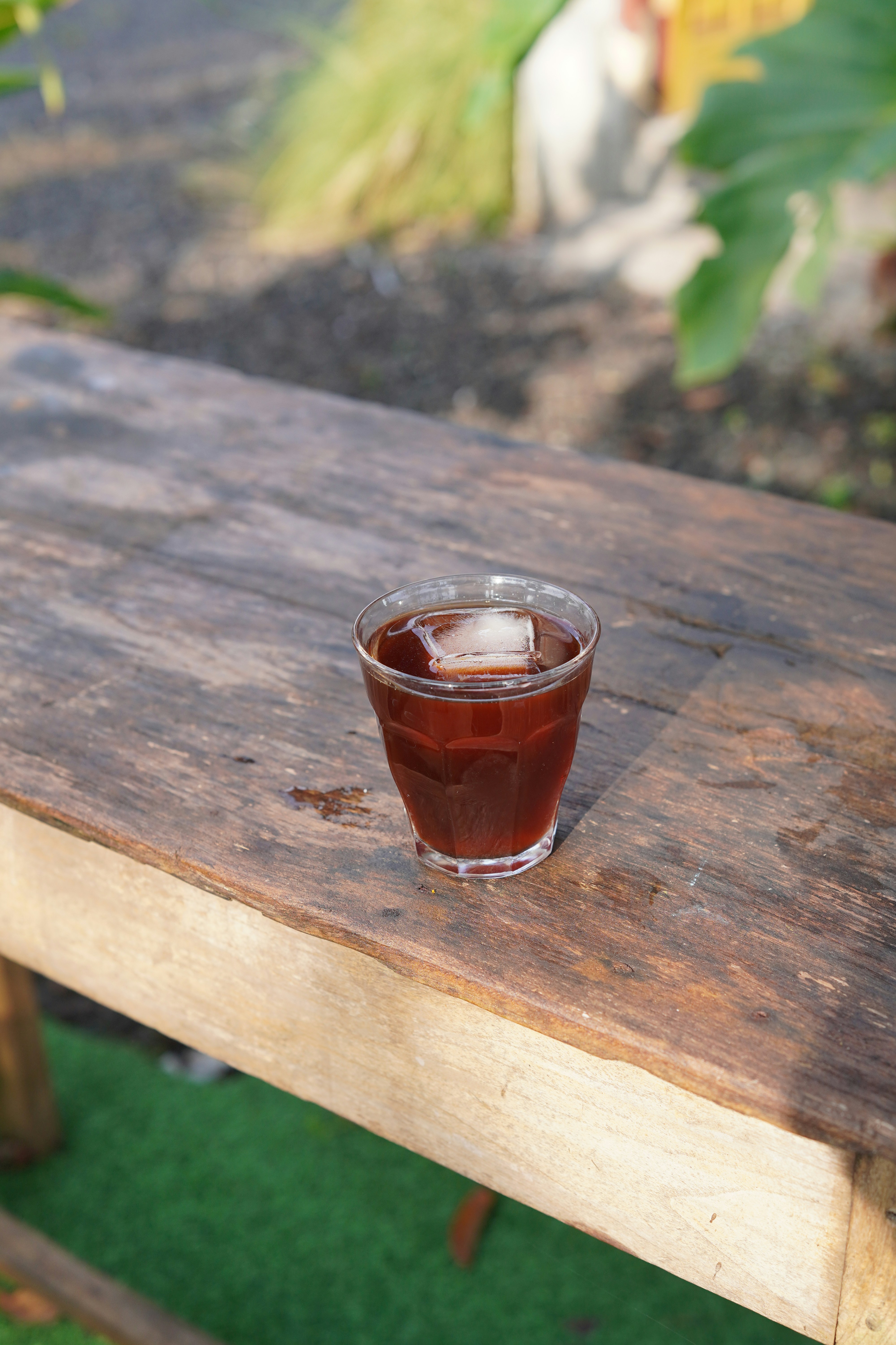 Cold brew coffee with ice on a wooden table