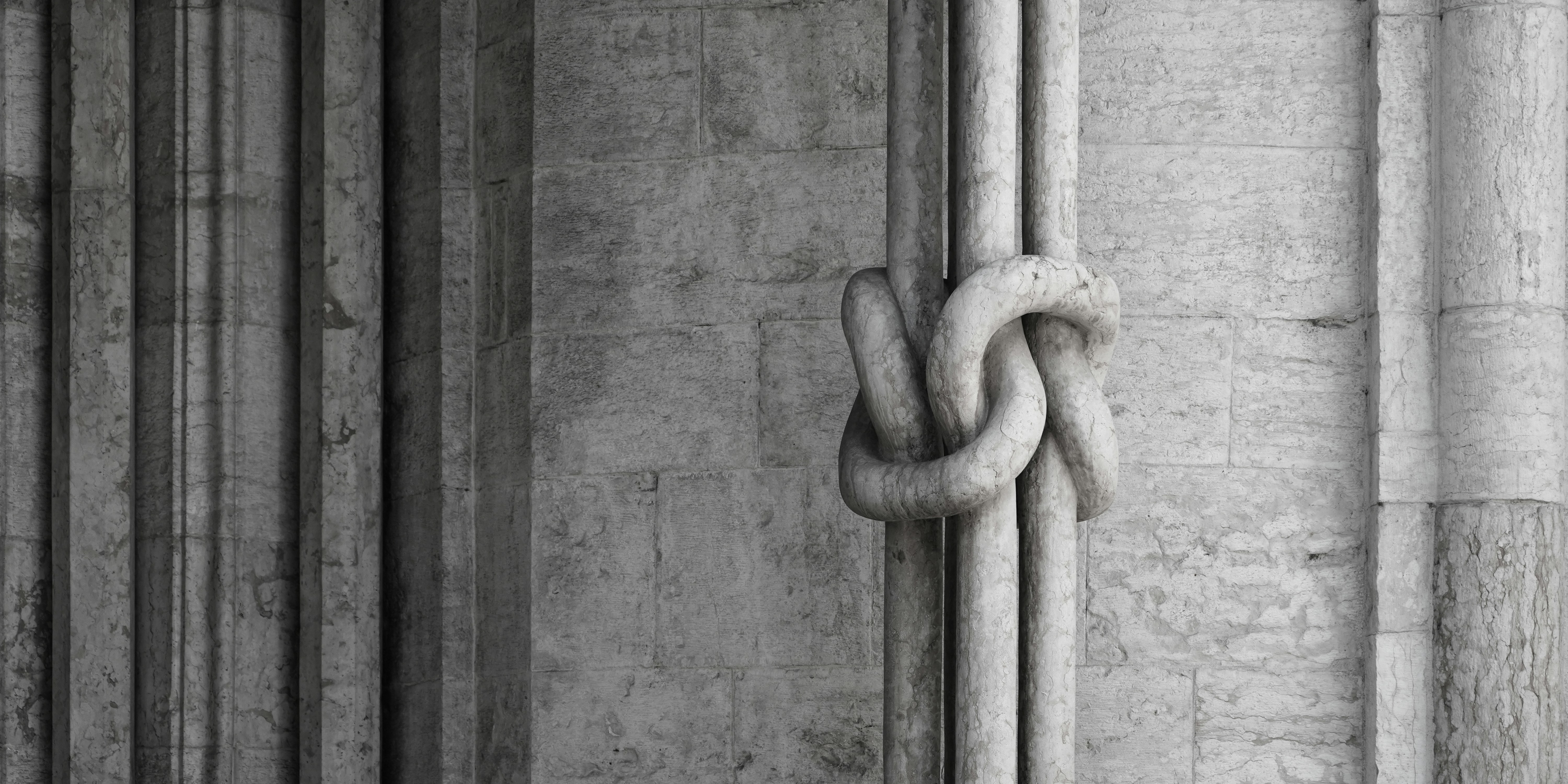 Two thick ropes tied together in a knot.