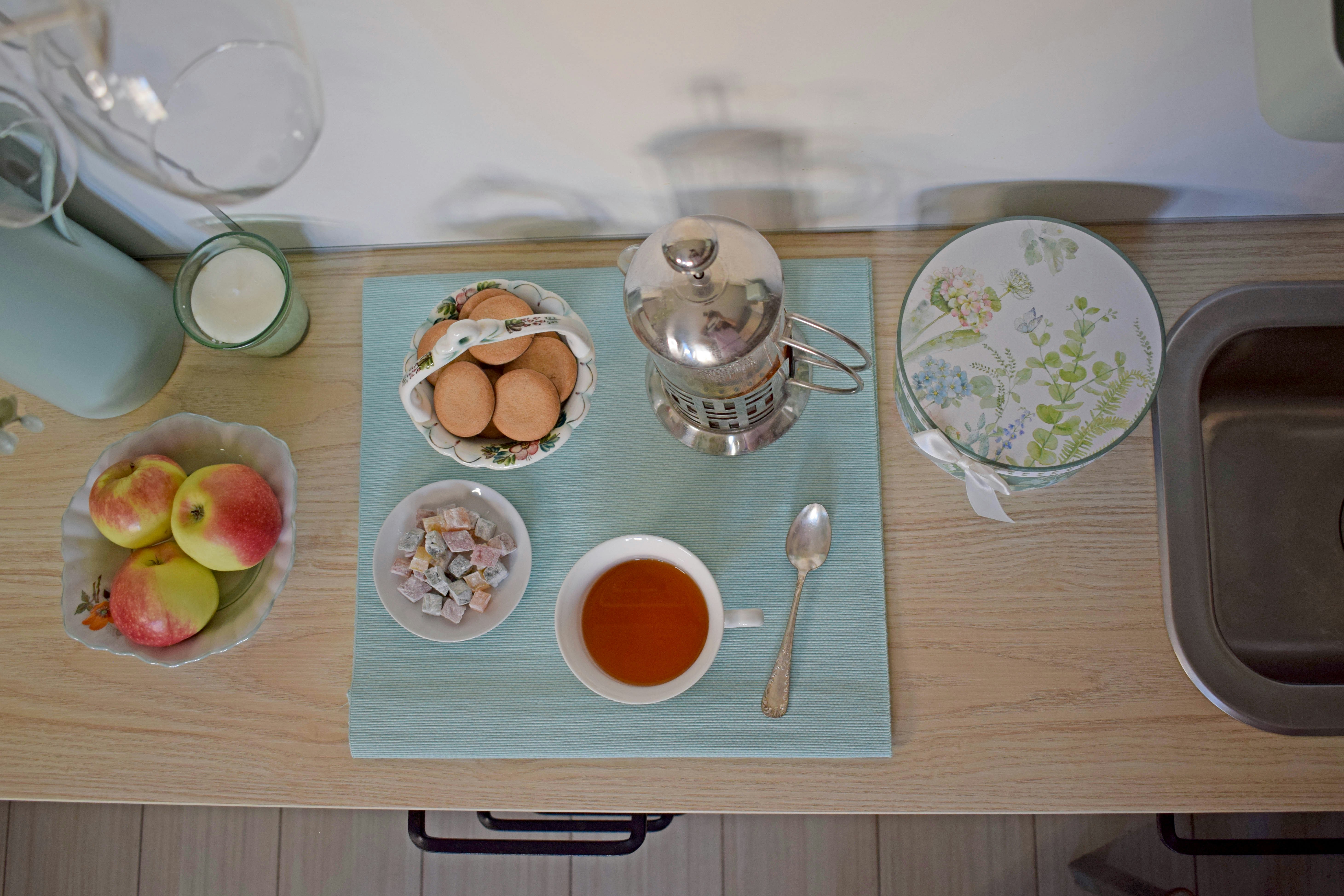 Breakfast table with eggs, fruit, and coffee