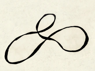 A black infinity symbol on a cream background