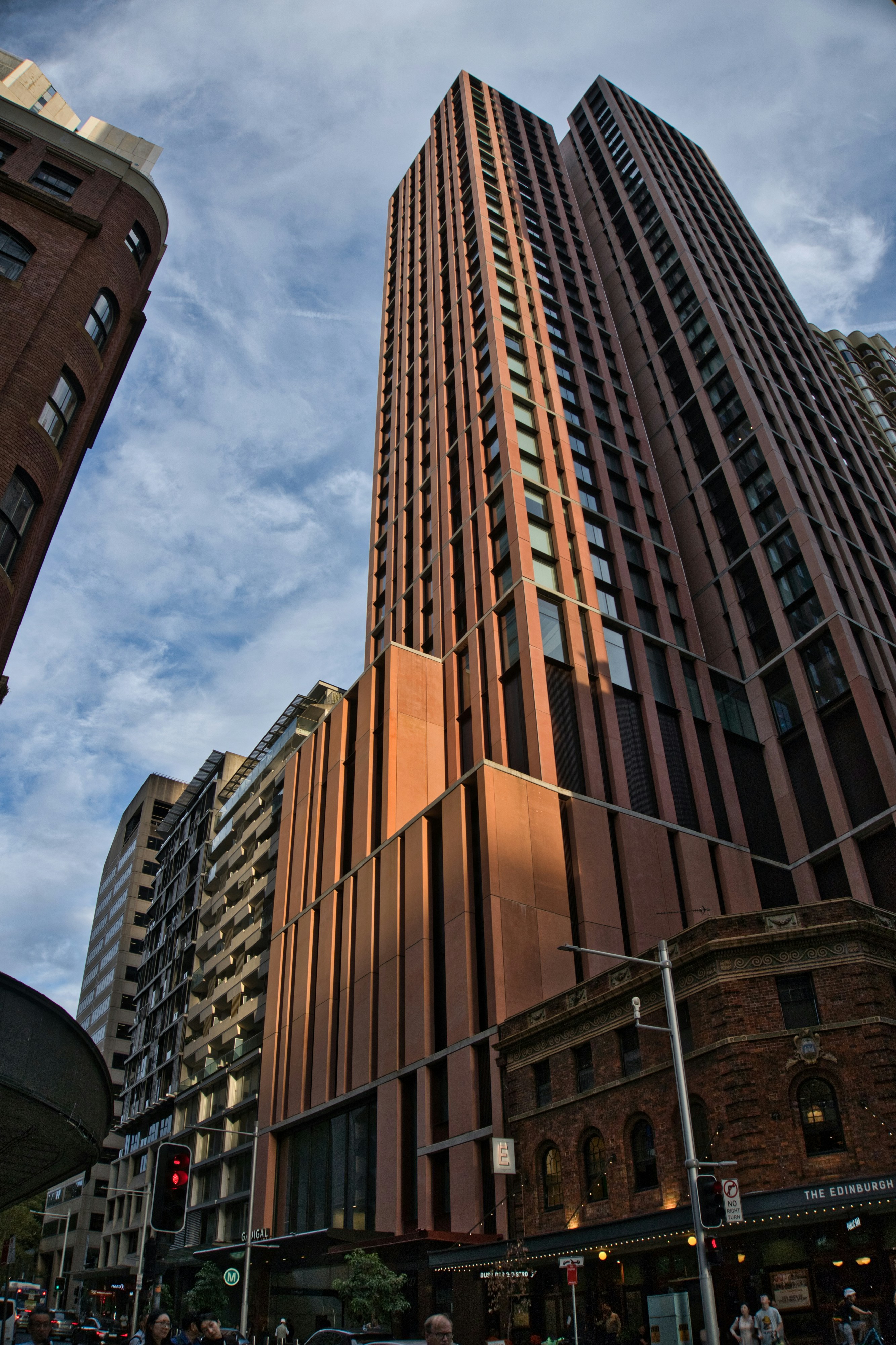 Tall modern buildings against a cloudy sky