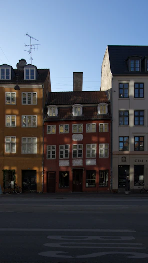 Row of colorful buildings under a clear blue sky.
