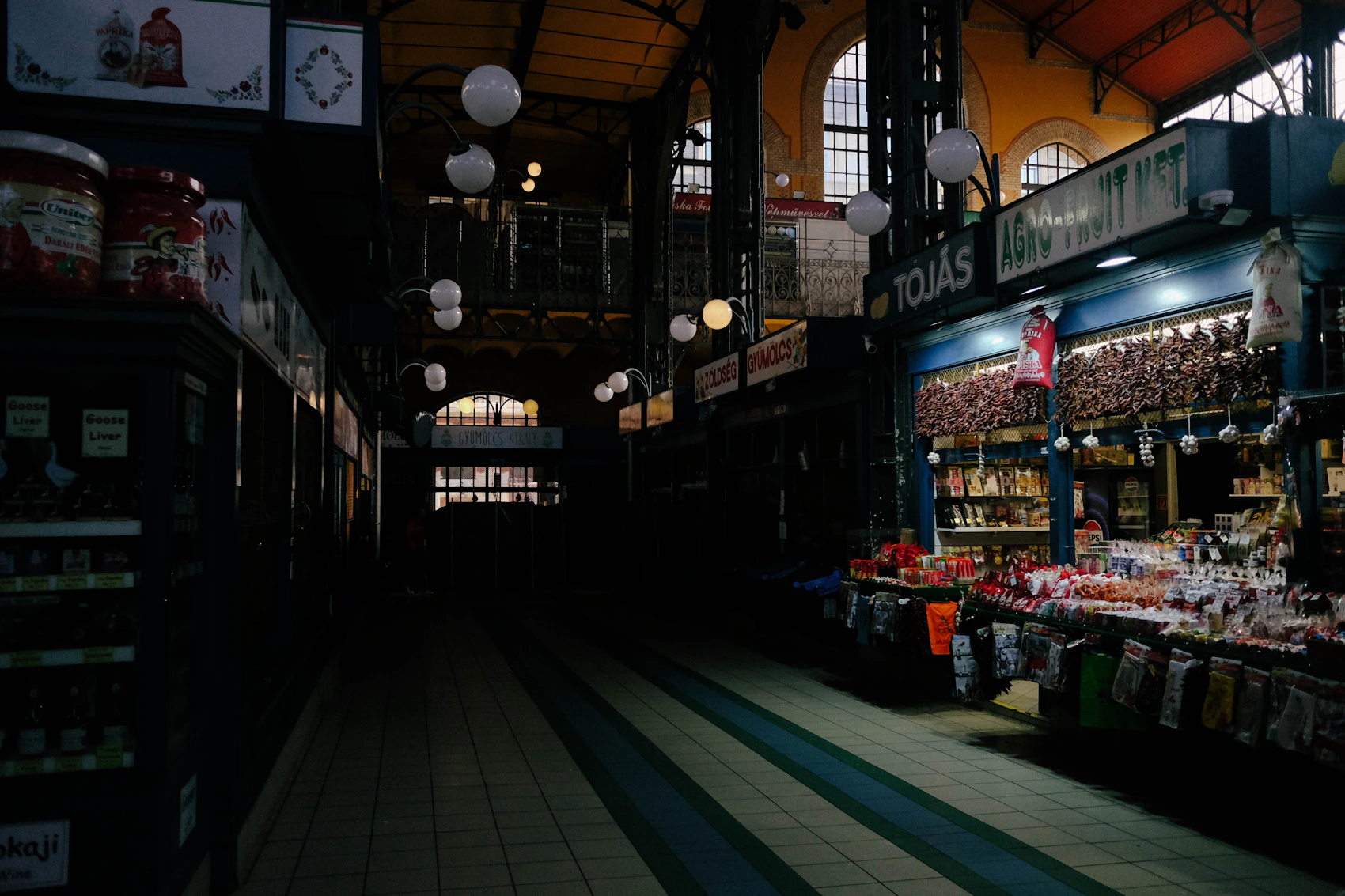Produce and food stalls beneath the ironwork of Budapest's Great Market Hall