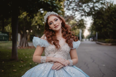 Young woman in a blue princess gown and tiara