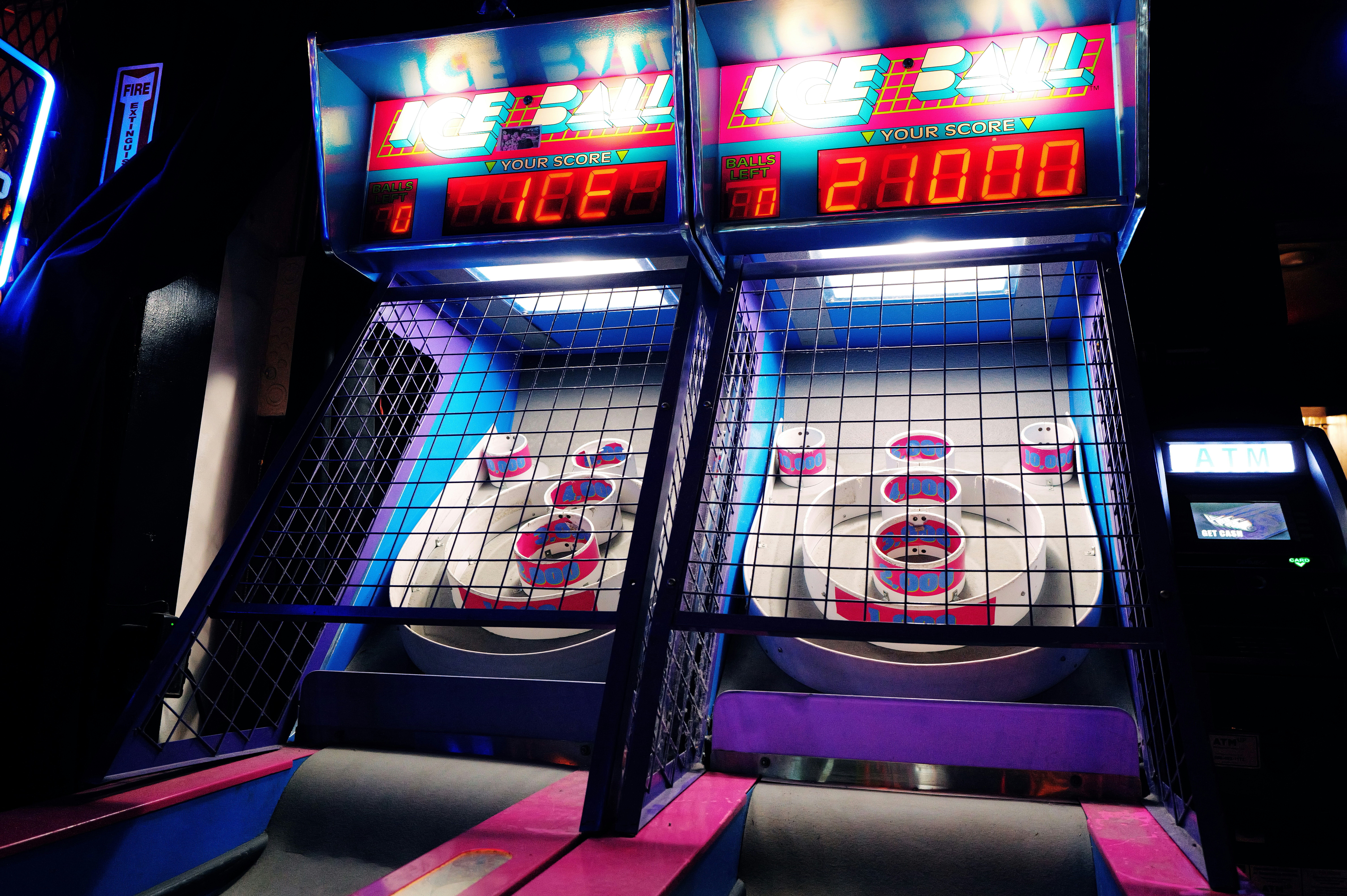 Two skee-ball machines in an arcade