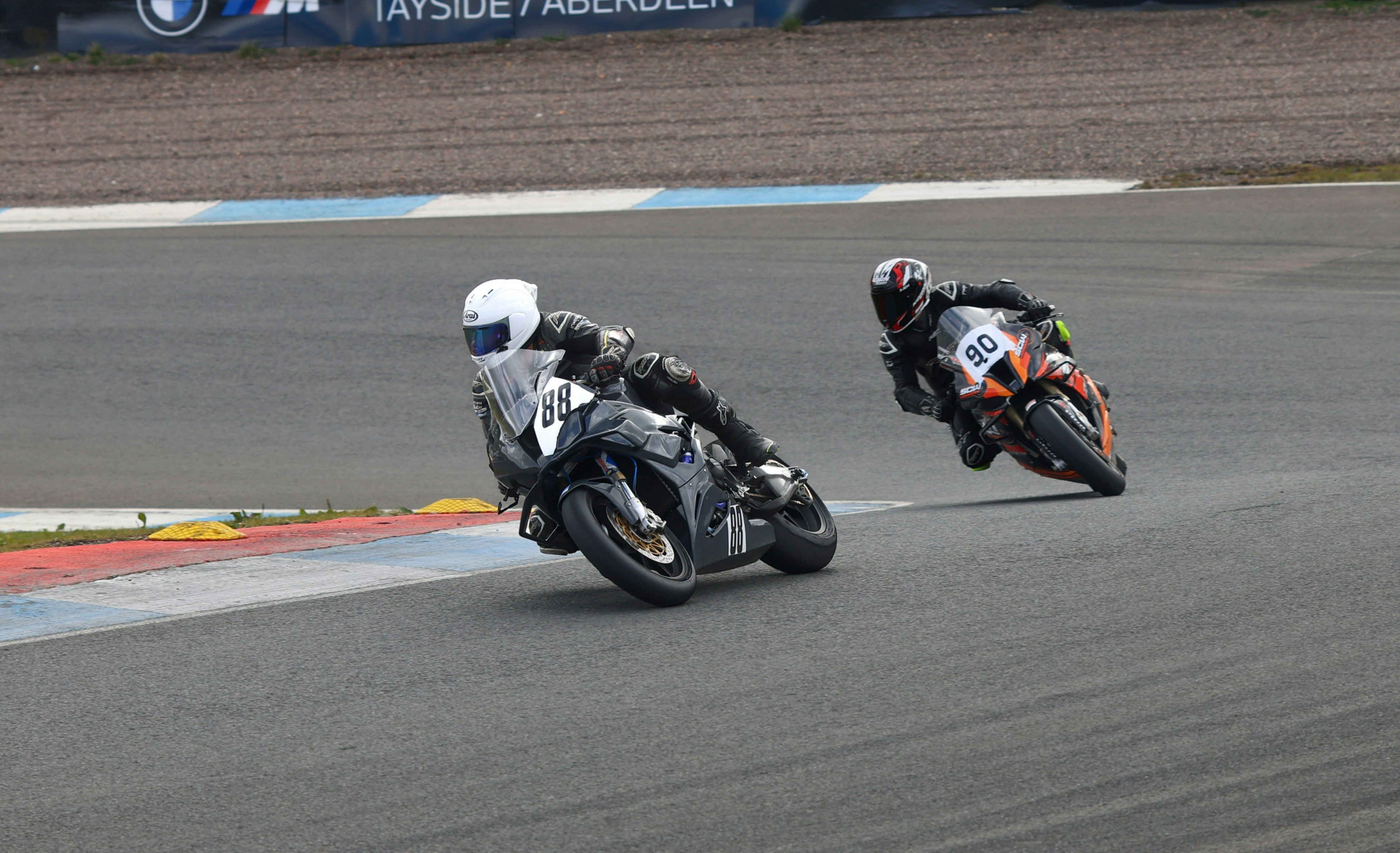 Two motorcycle racers speeding on a track