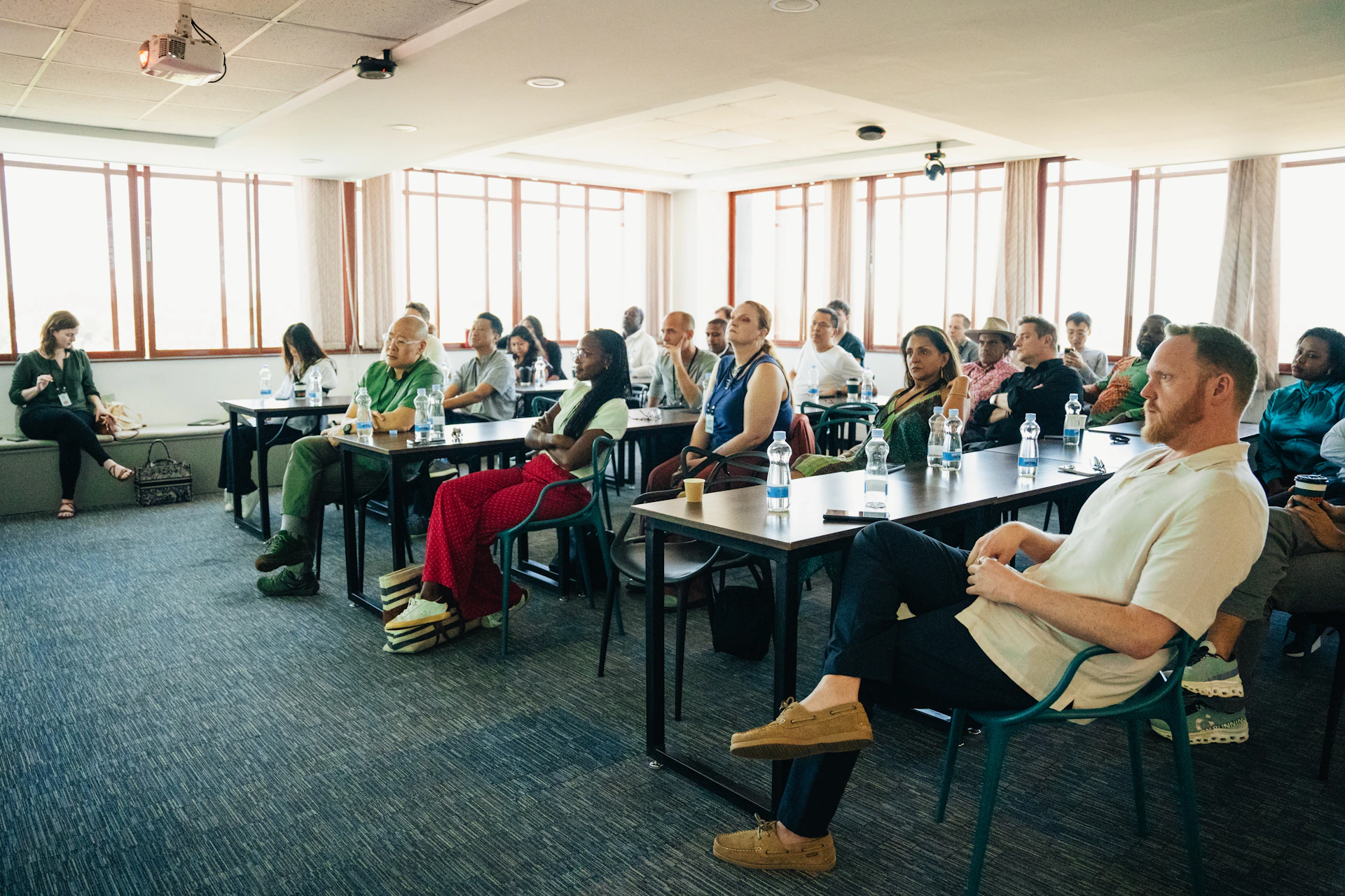 Audience attentively listening during a presentation in-person conference presentation.