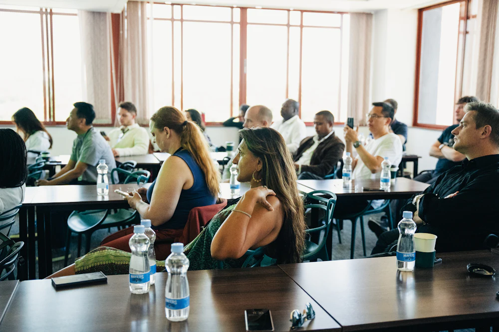 People seated at tables during a training session