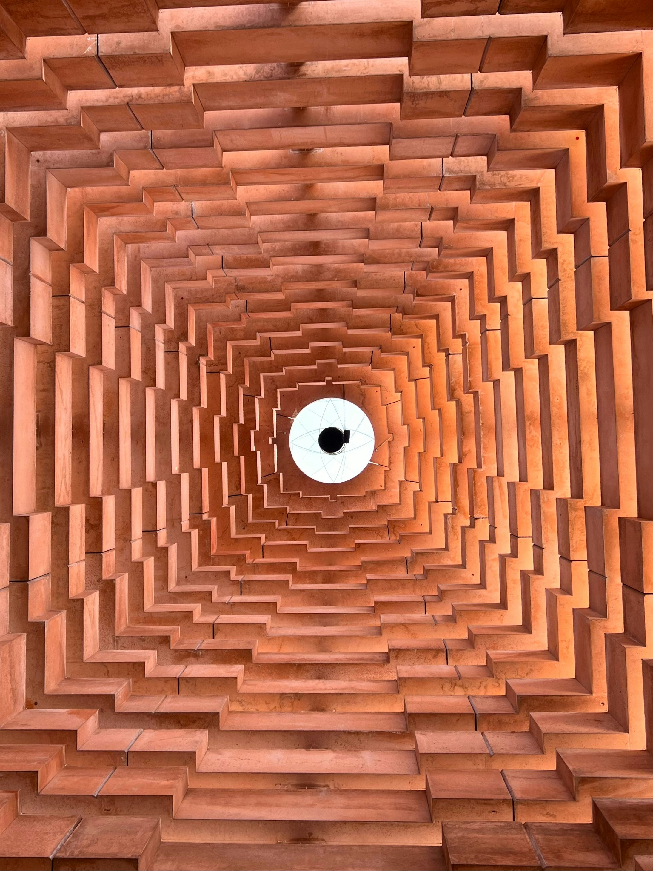 Tiled ceiling with a light fixture in the center