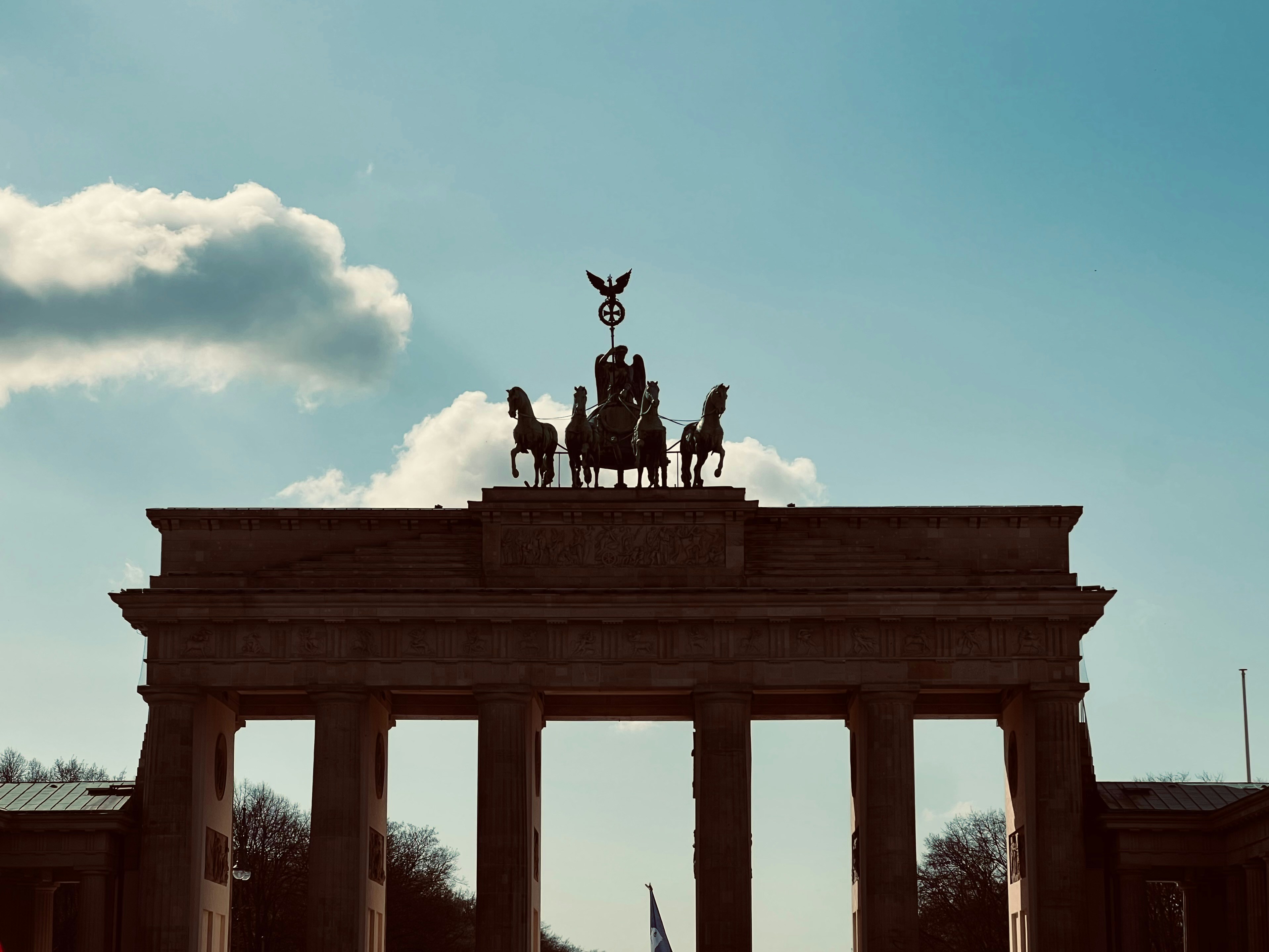 Brandenburg gate in berlin under a cloudy sky
