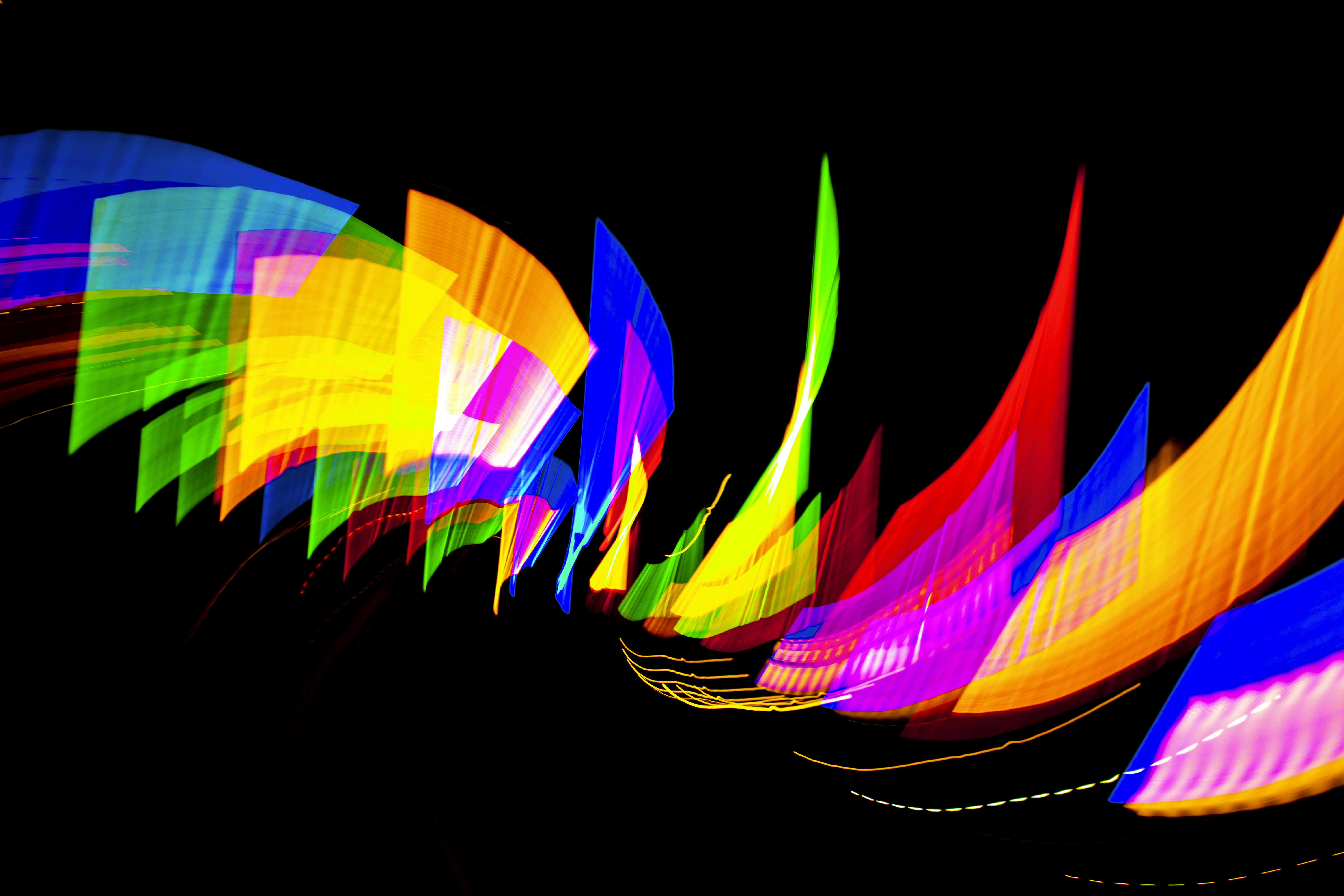 Abstract colorful light streaks on black background