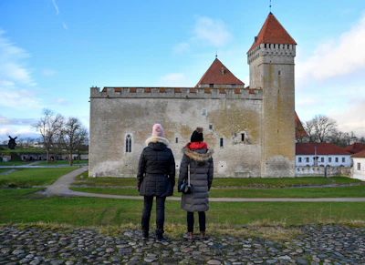 Two visitors in front of Kuressaare castle on Saaremaa