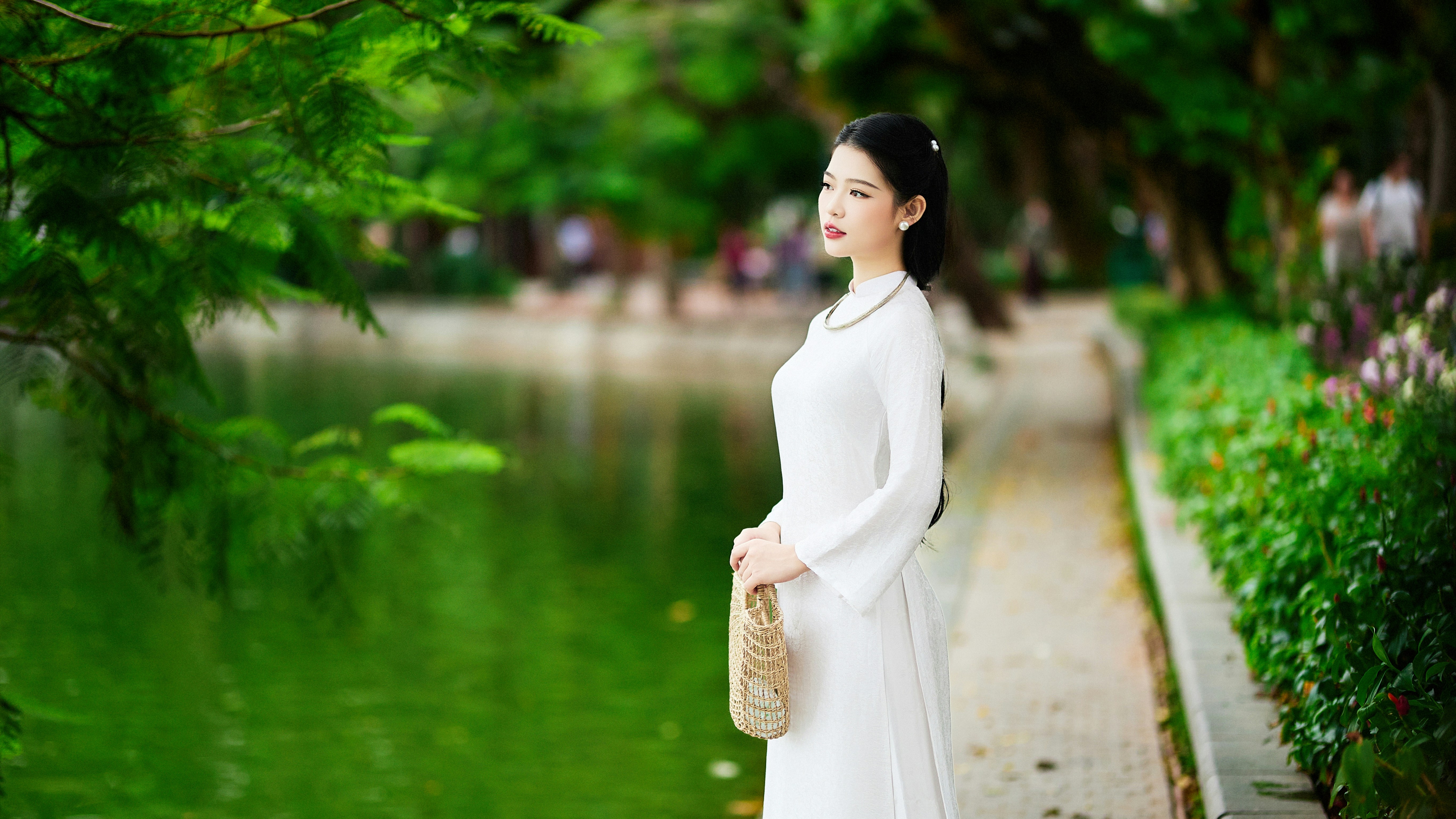 A woman in a white dress by a lake photo – Free Woman Image on Unsplash
