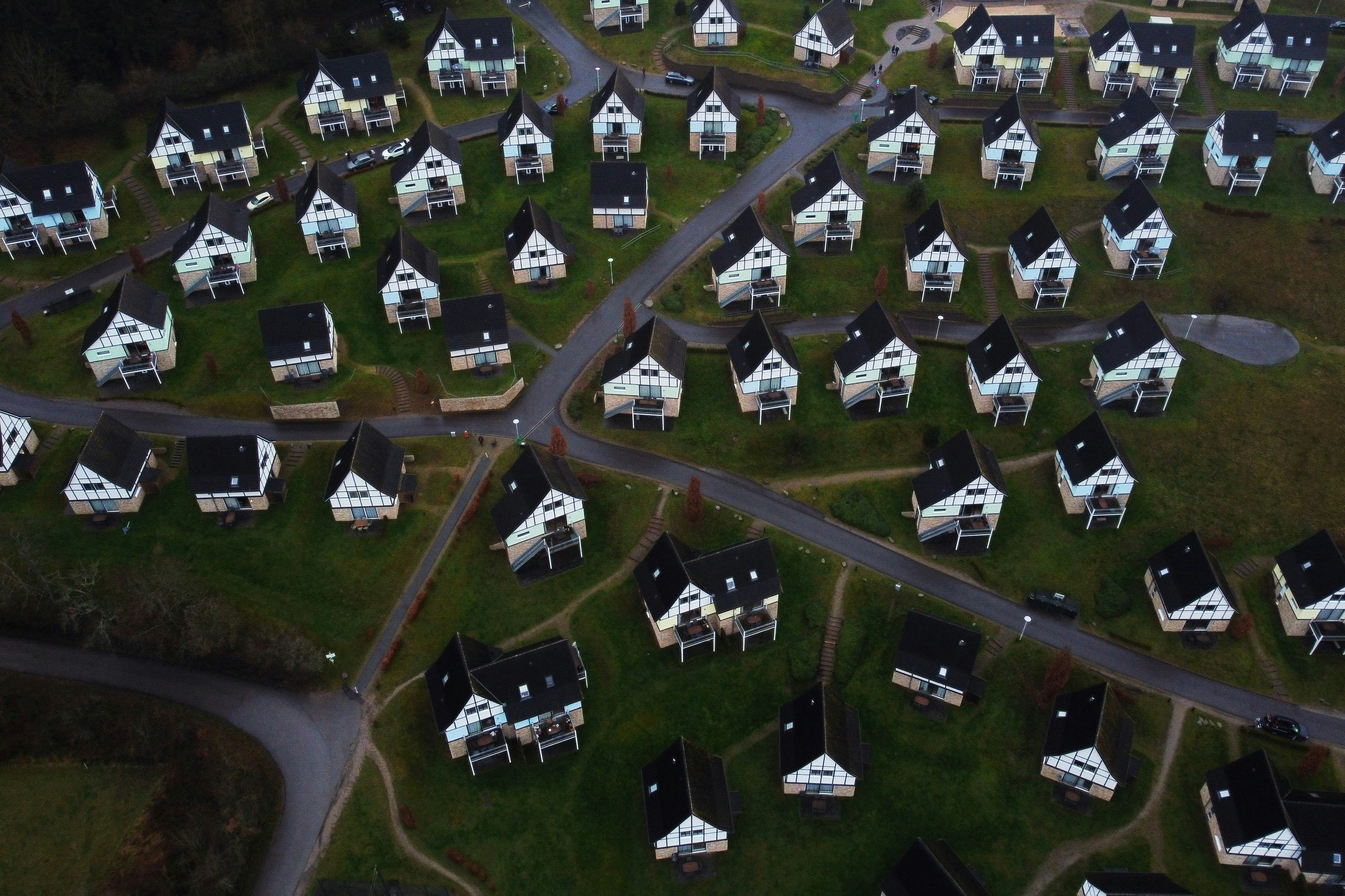 Aerial view of a village with many small white houses