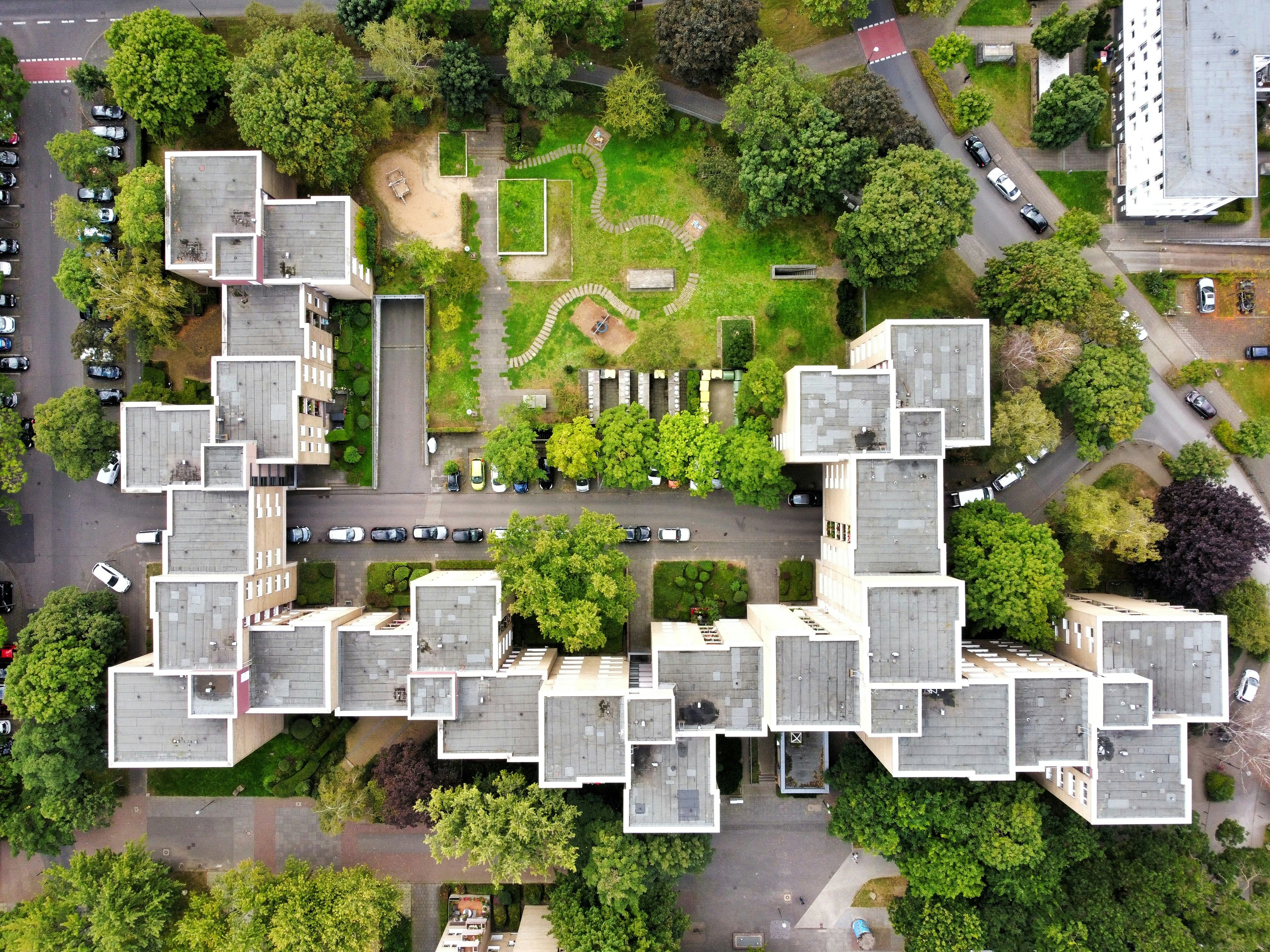 Aerial view of a modern apartment complex with green courtyards - Free ...
