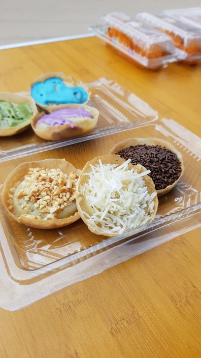 Assortment of colorful sweet crepes with various toppings