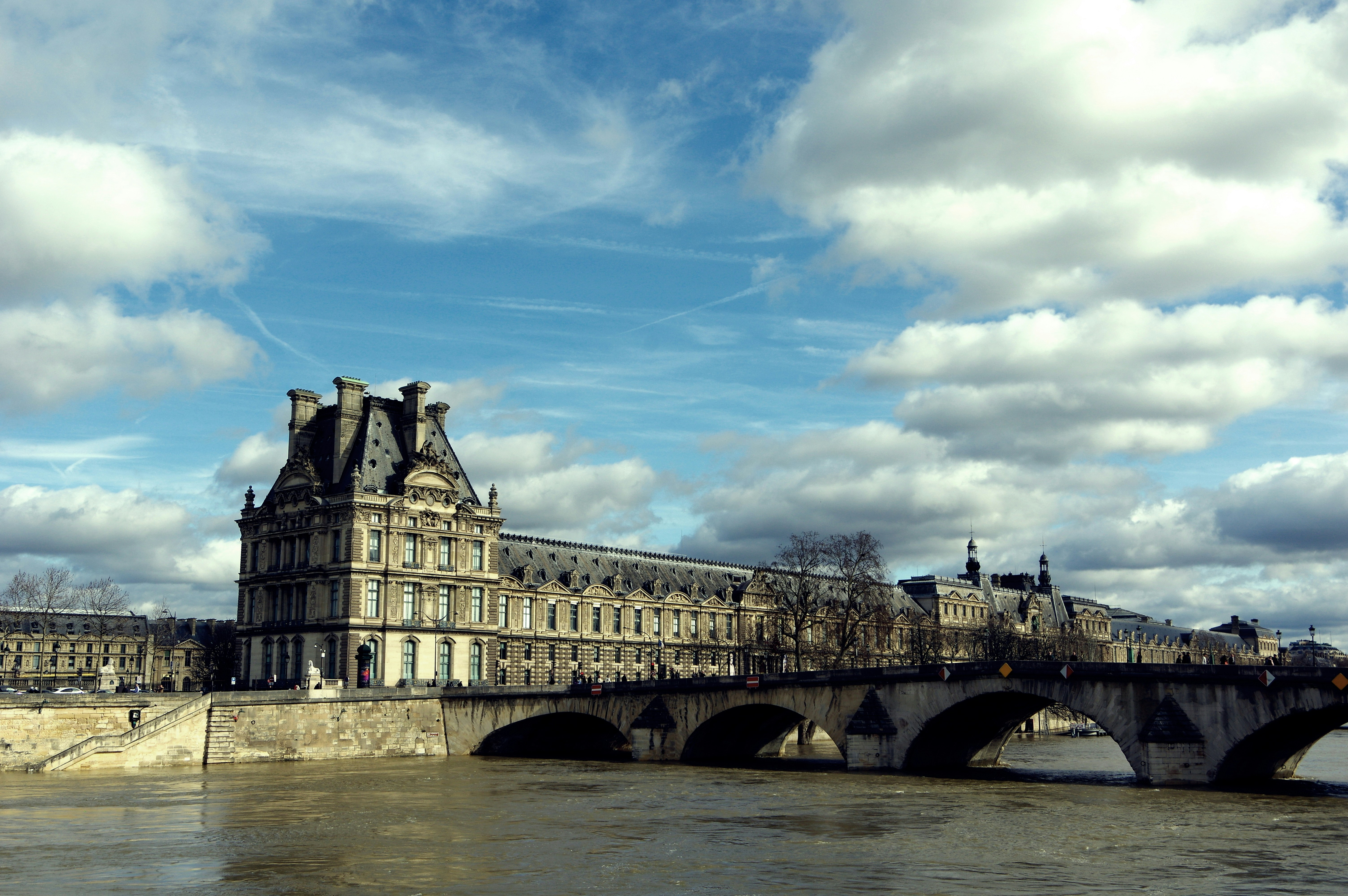 Louvre museum and bridge over the seine river