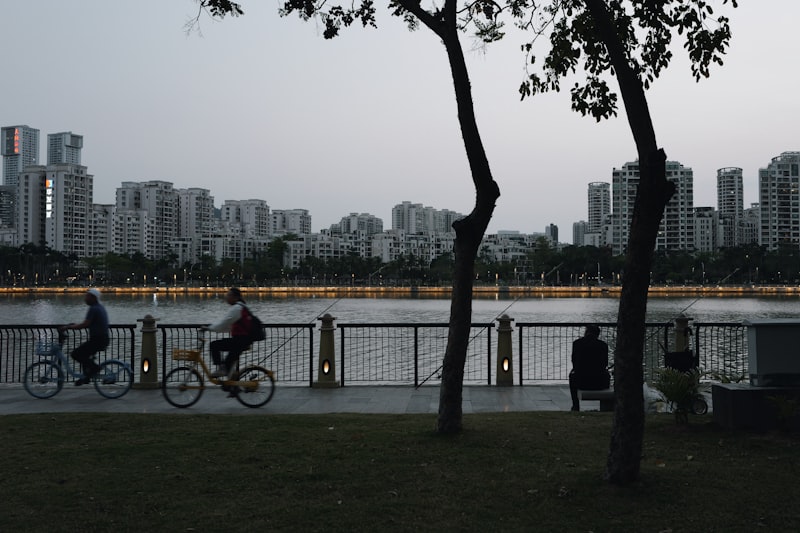 Qiantang River cycling path with city skyline and sunset
